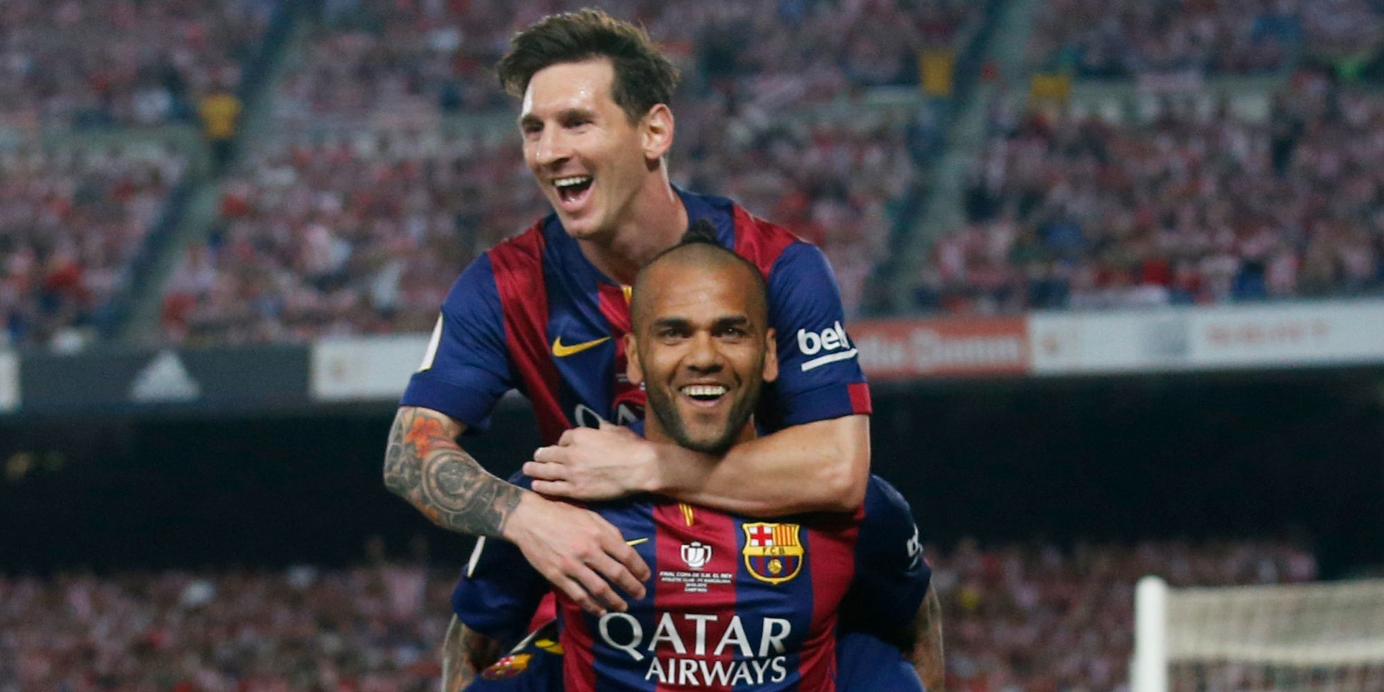 Dani Alves and Lionel Messi celebrate