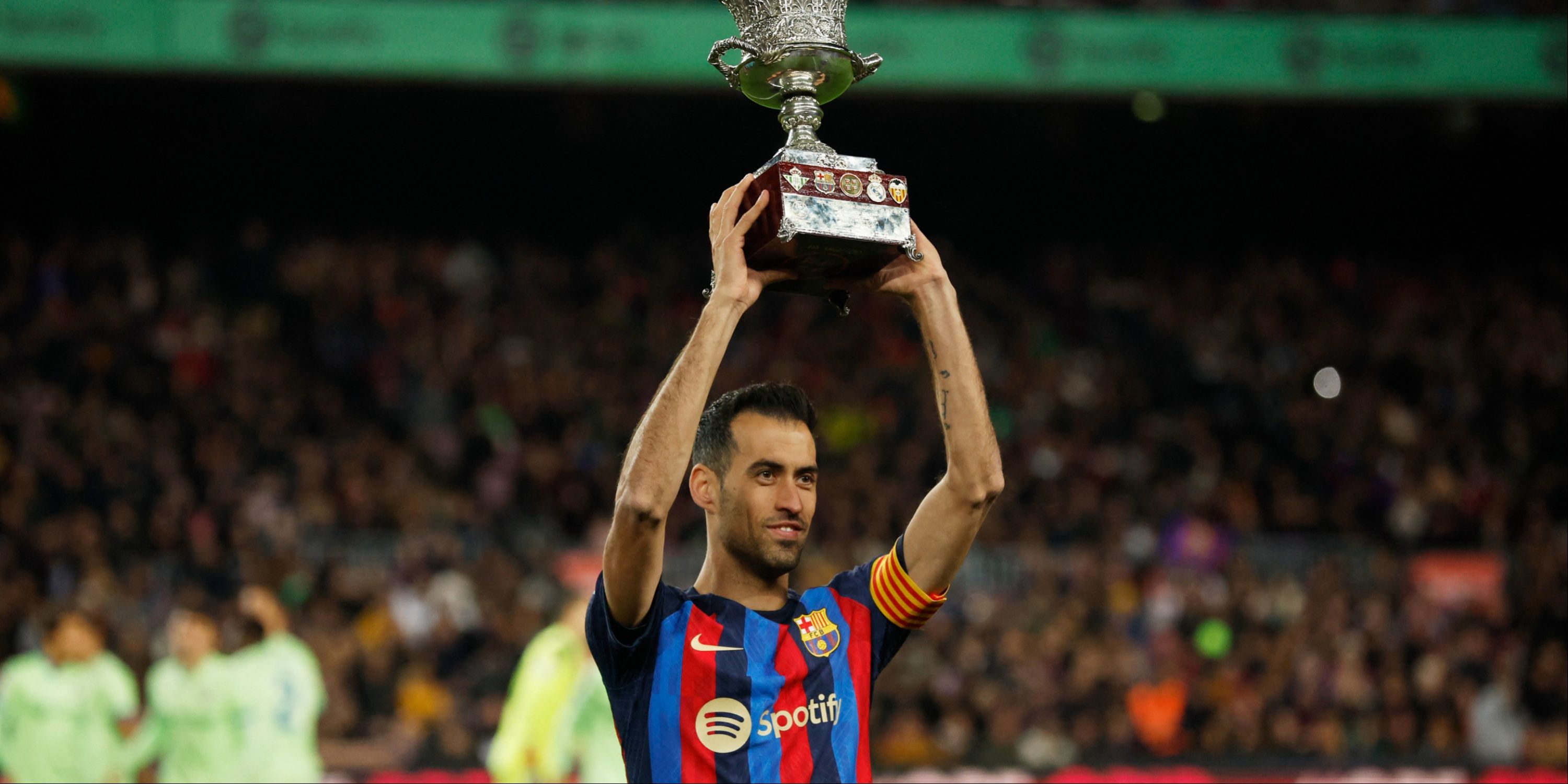 Sergio Busquets celebrating with a trophy