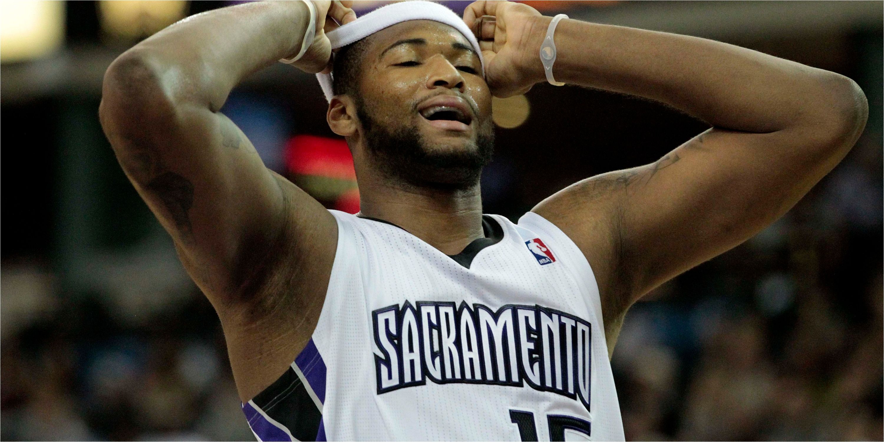 Kings center DeMarcus Cousins pulls off headband in frustration