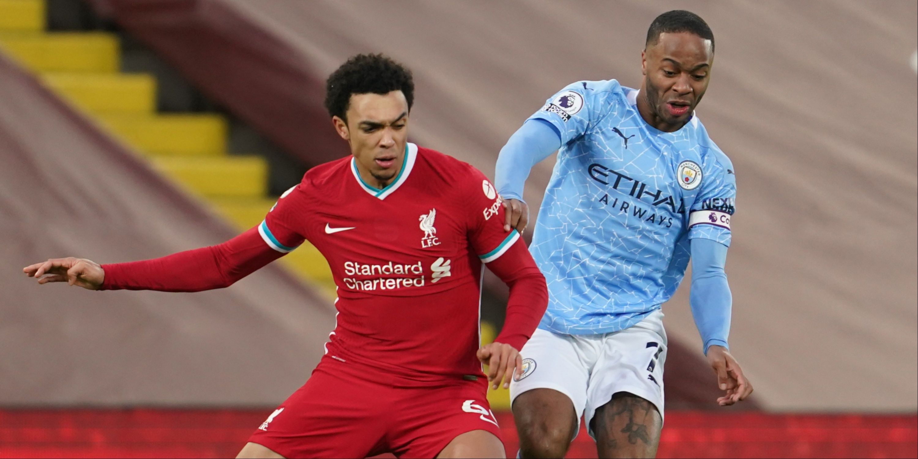 Trent Alexander-Arnold and Raheem Sterling battle for the ball