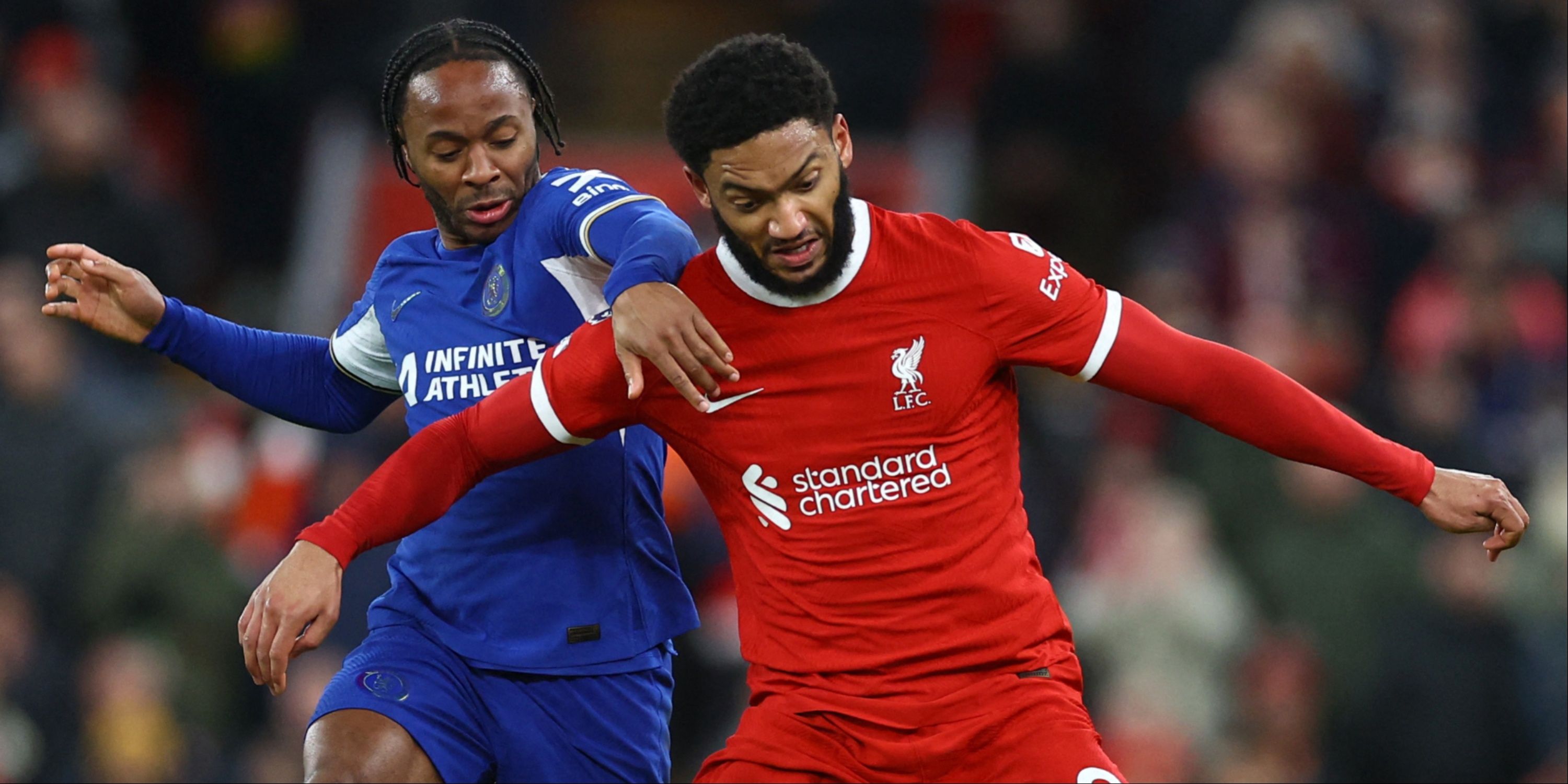 Raheem Sterling and Joe Gomez battle for the ball