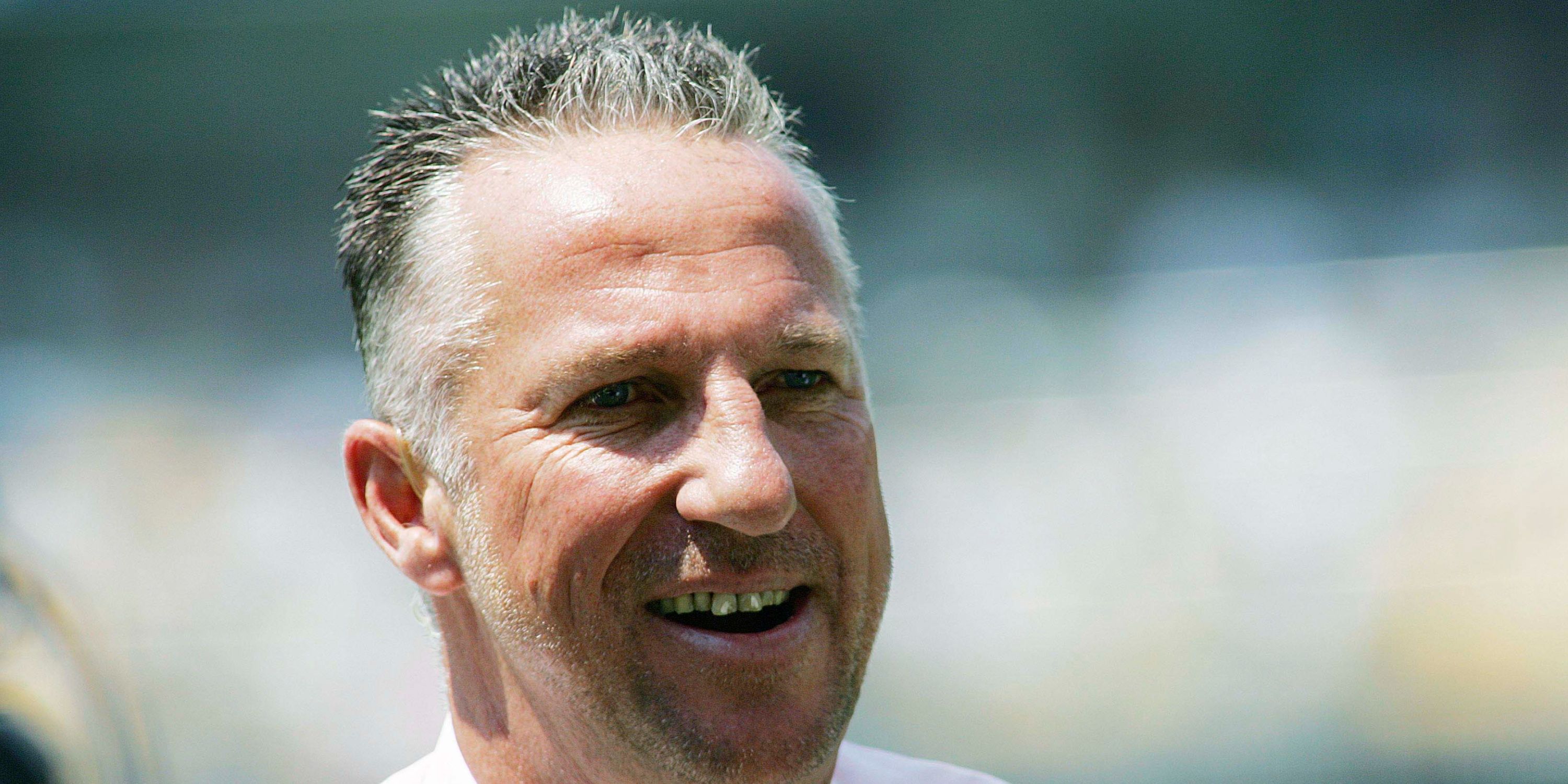 Ian Botham at a cricket match as commentator