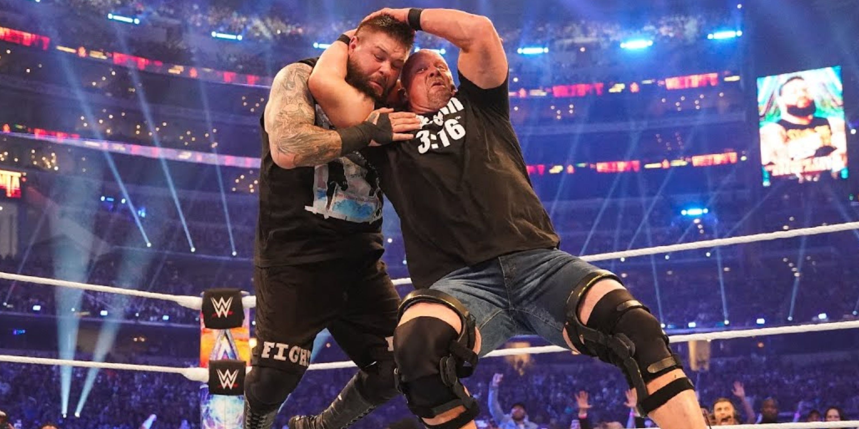 Stone Cold Steve Austin hitting Kevin Owens with the stunner at WWE WrestleMania 