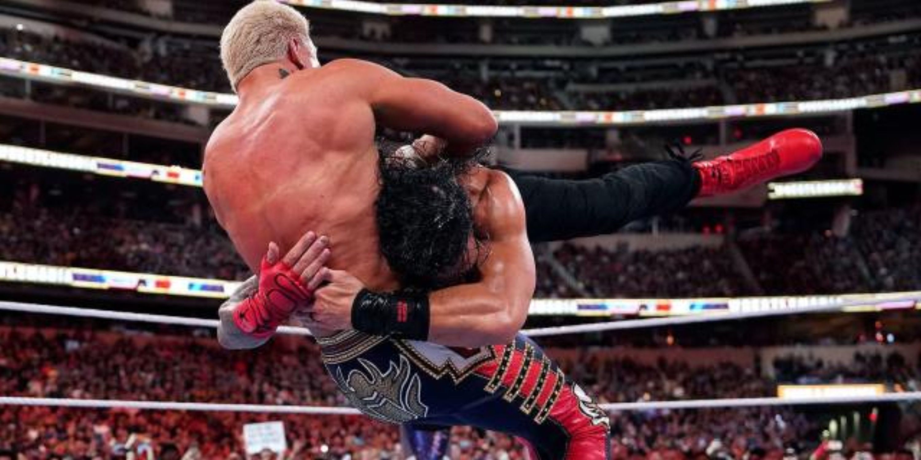 Roman Reigns spearing Cody Rhodes at WWE WrestleMania 39