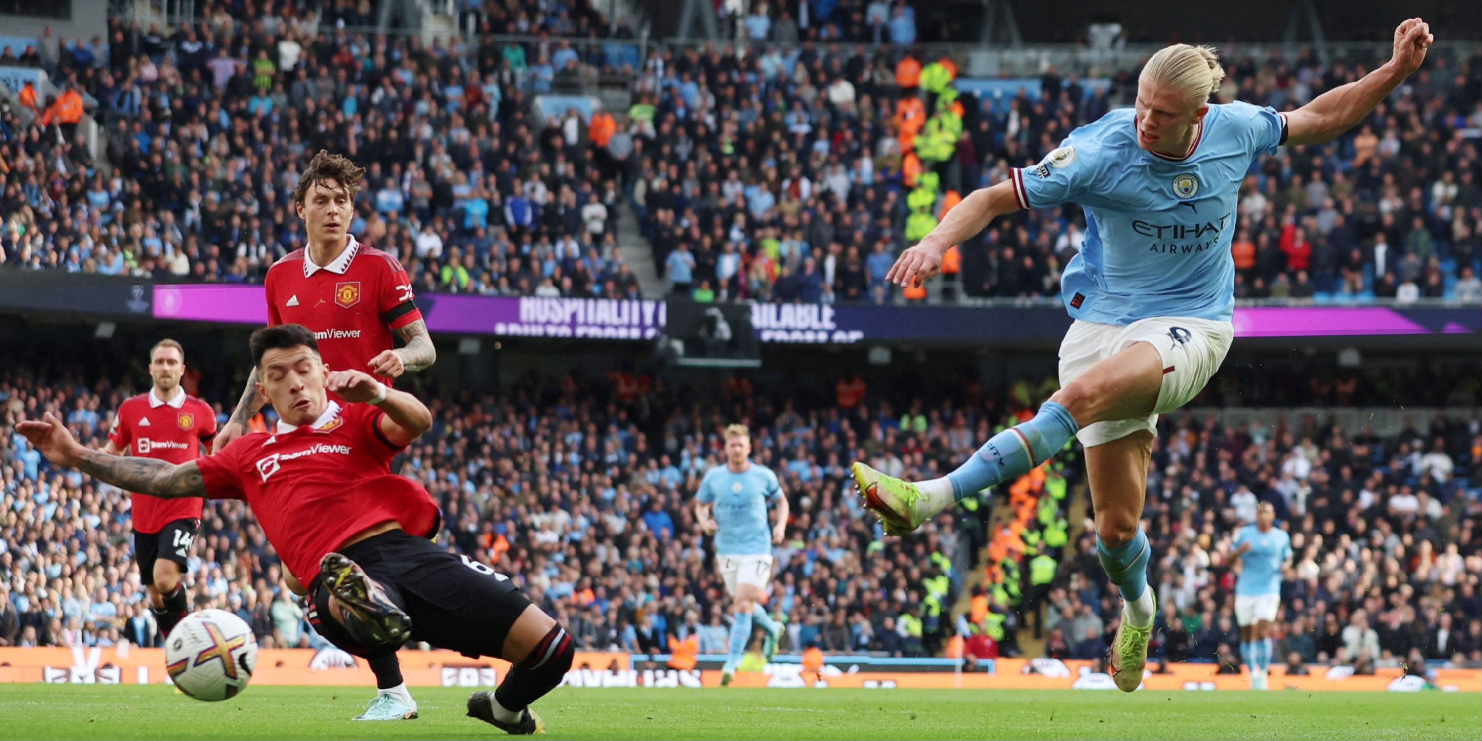 Erling Haaland and Lisandro Maritnez in action during the Manchester derby