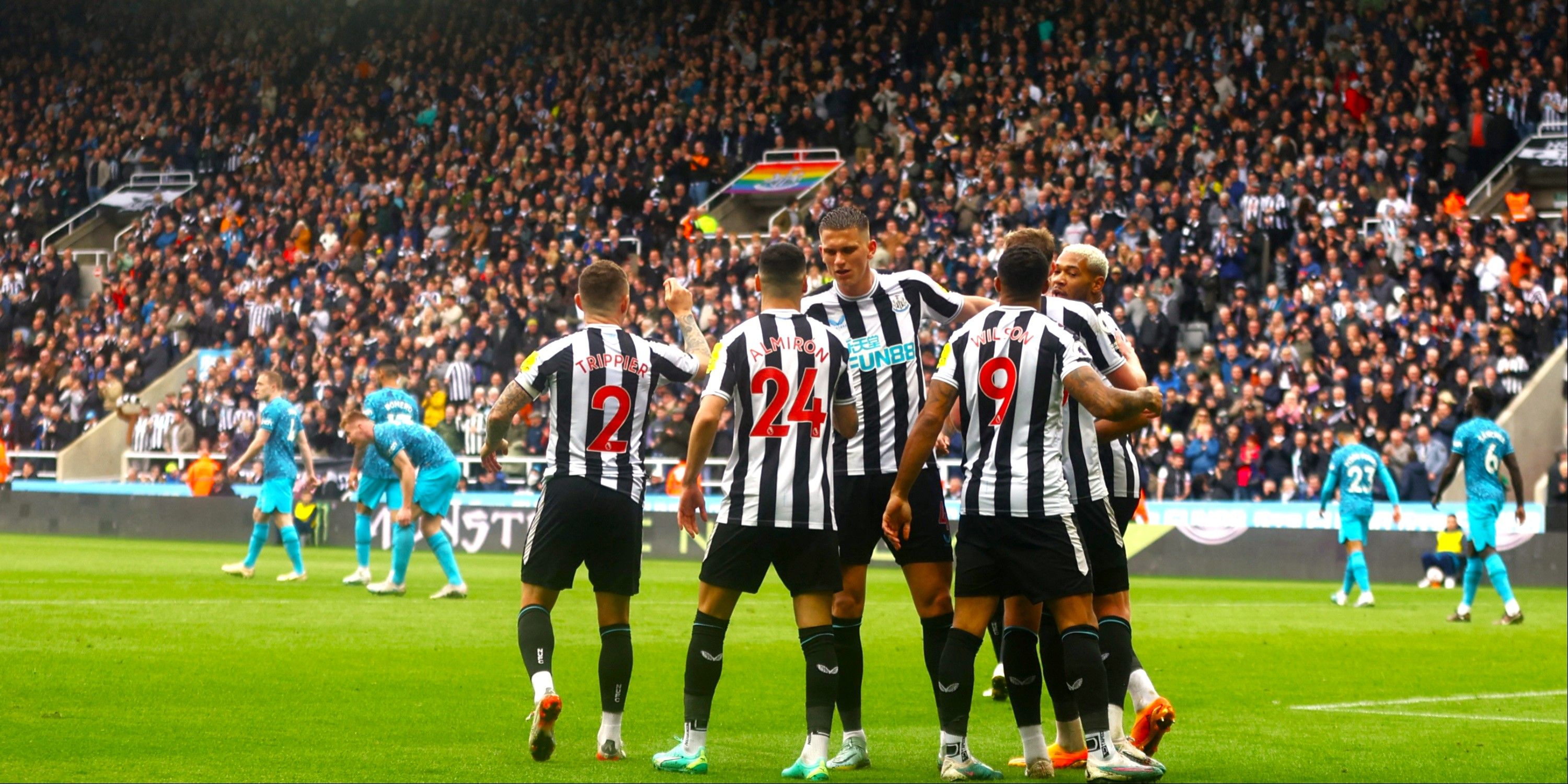 Newcastle United players celebrate scoring against Tottenham.