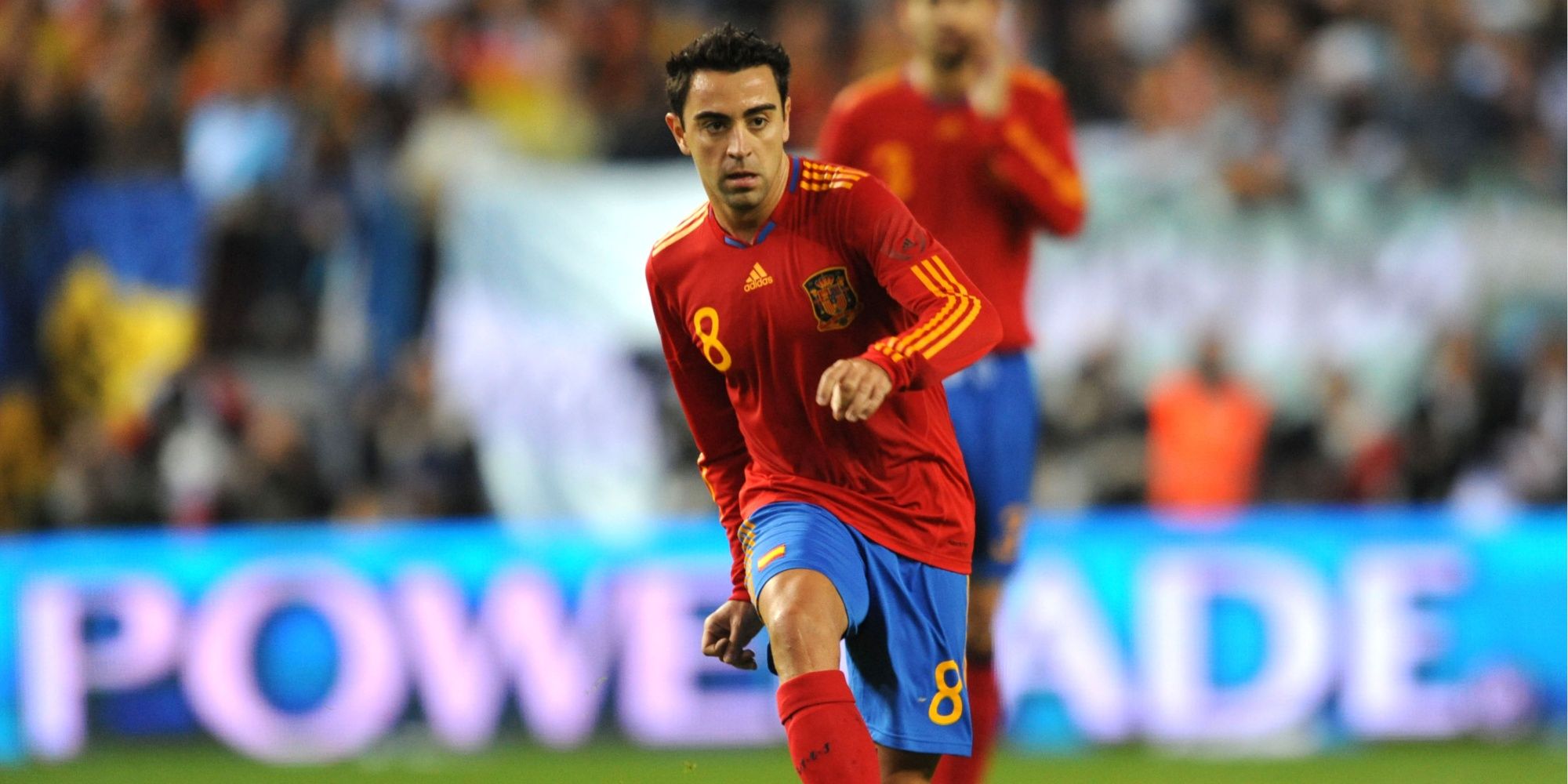 Xavi passing the ball for Spain