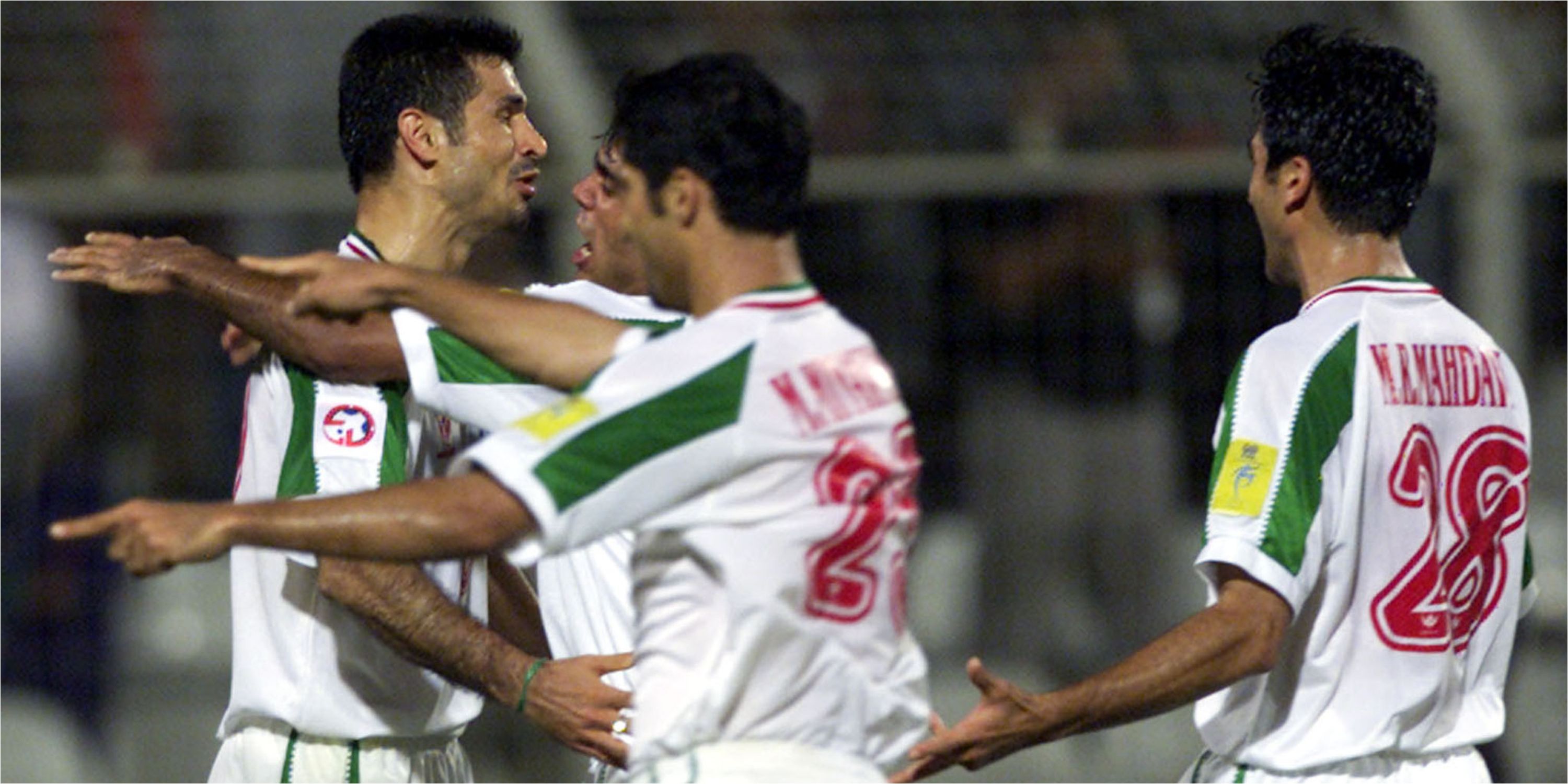 Players for the Iran national team celebrate a goal