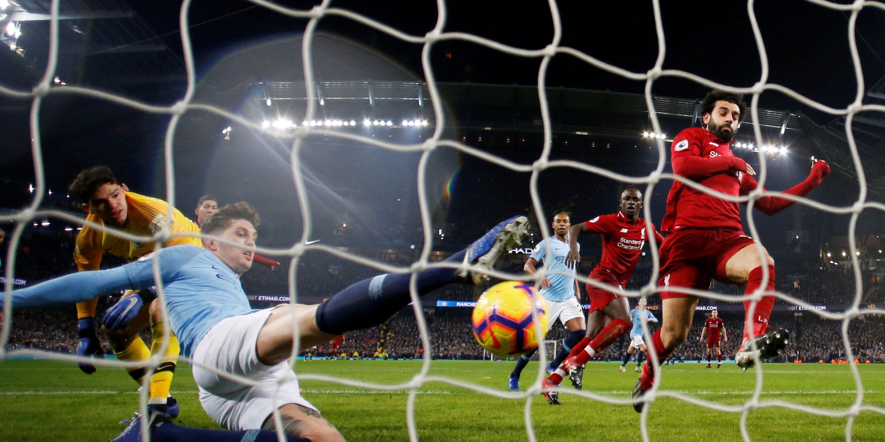 Manchester City's John Stones makes a goalline clearance against Liverpool.