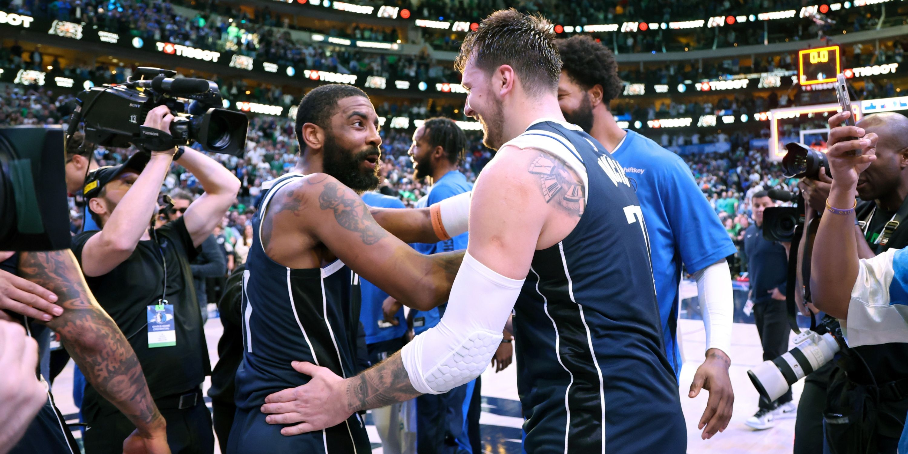 Luka Doncic celebrating with Kyrie Irving