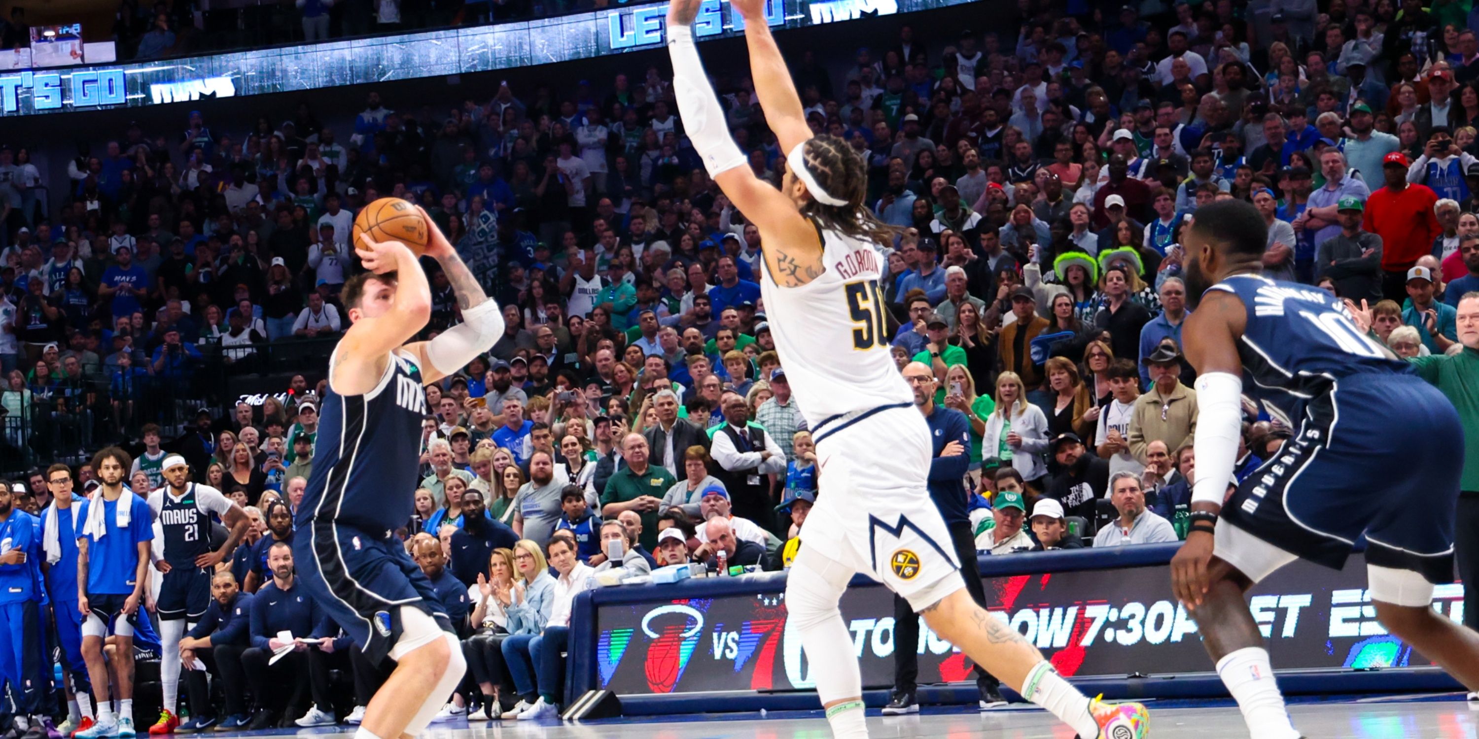 Mavericks' Luka Doncic shooting a three-pointer