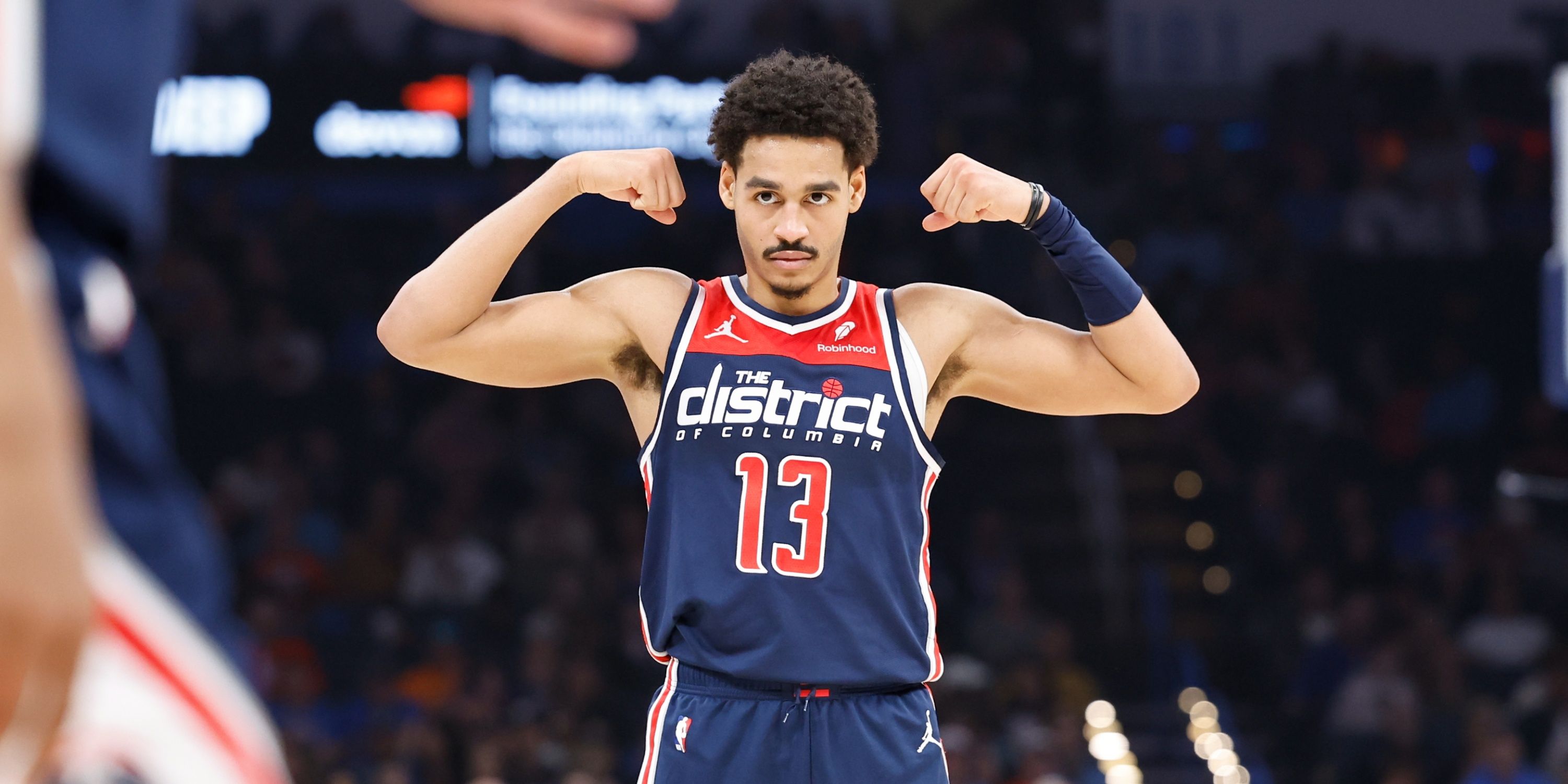 Wizards guard Jordan Poole flexes his muscles