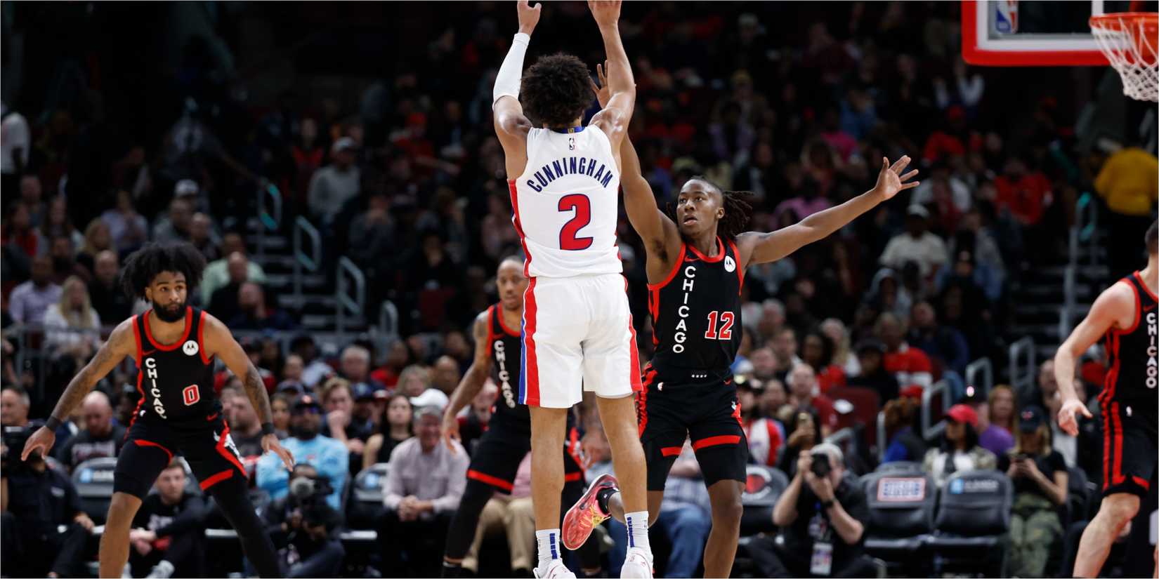Pistons guard Cade Cunningham shoots over Bulls wing Ayo Dosunmo