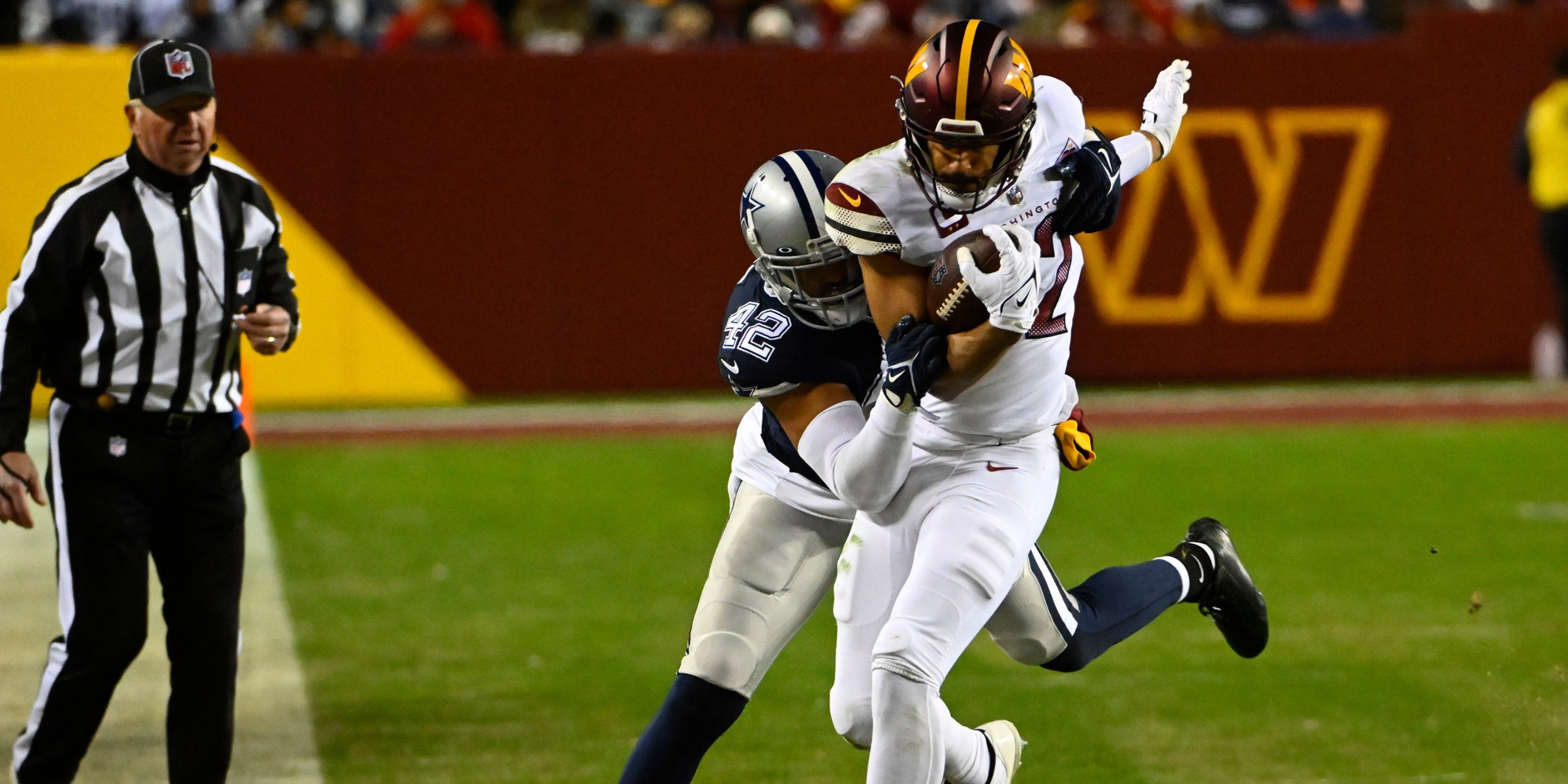 Logan Thomas is tackled after making a catch 