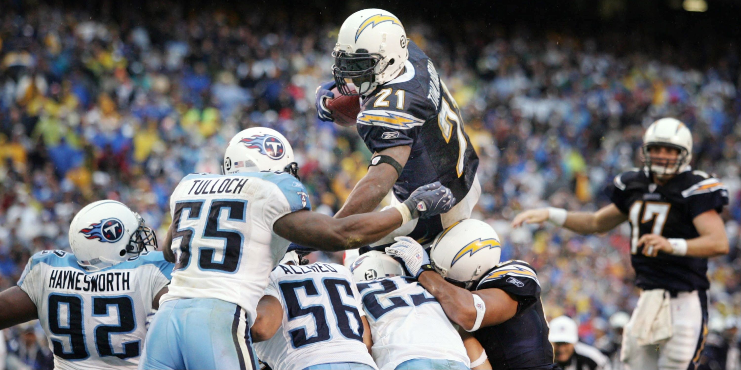 LaDainian Tomlinson leaps over defenders at the goal line