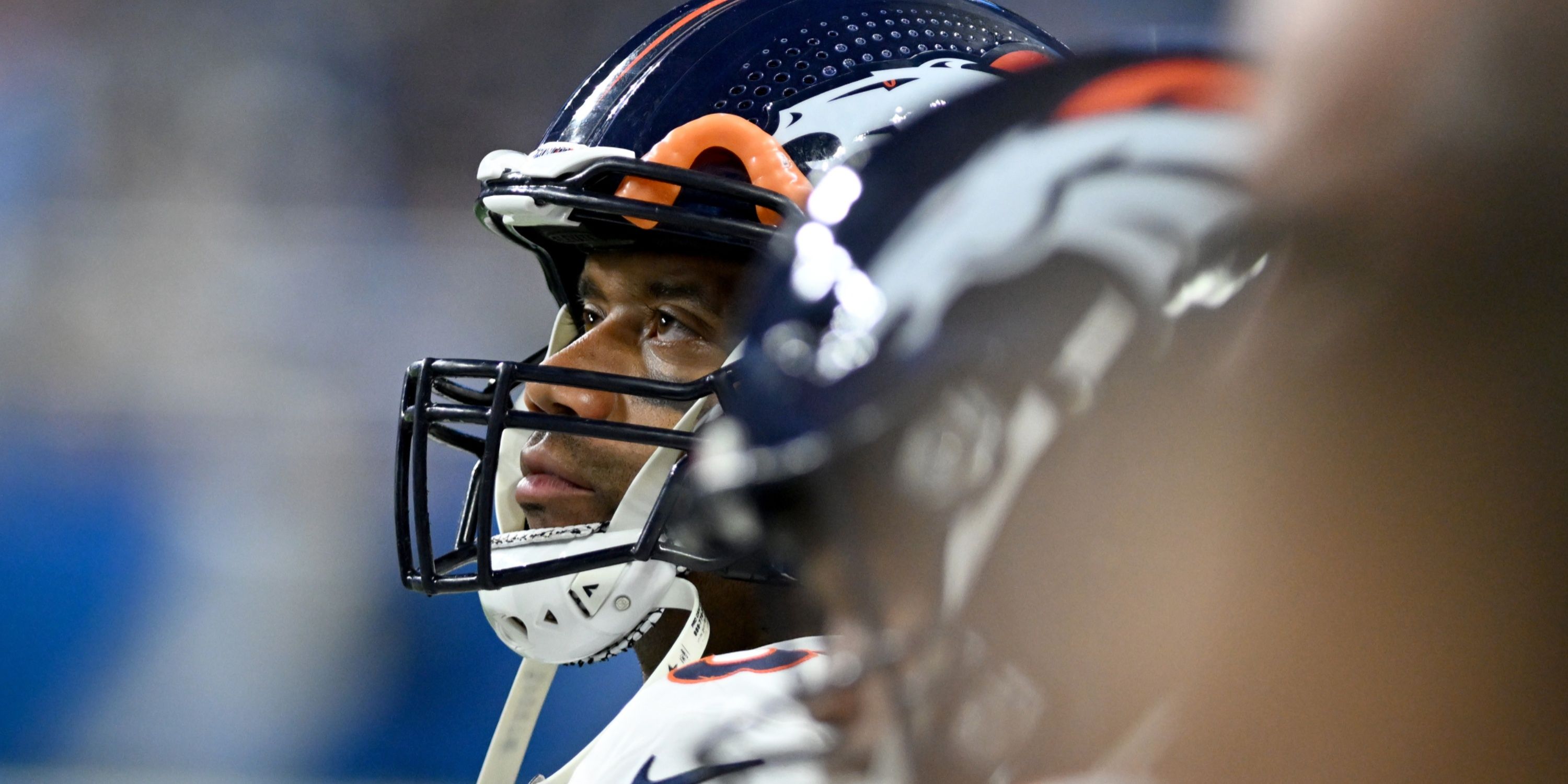 Russell Wilson looks on from sideline