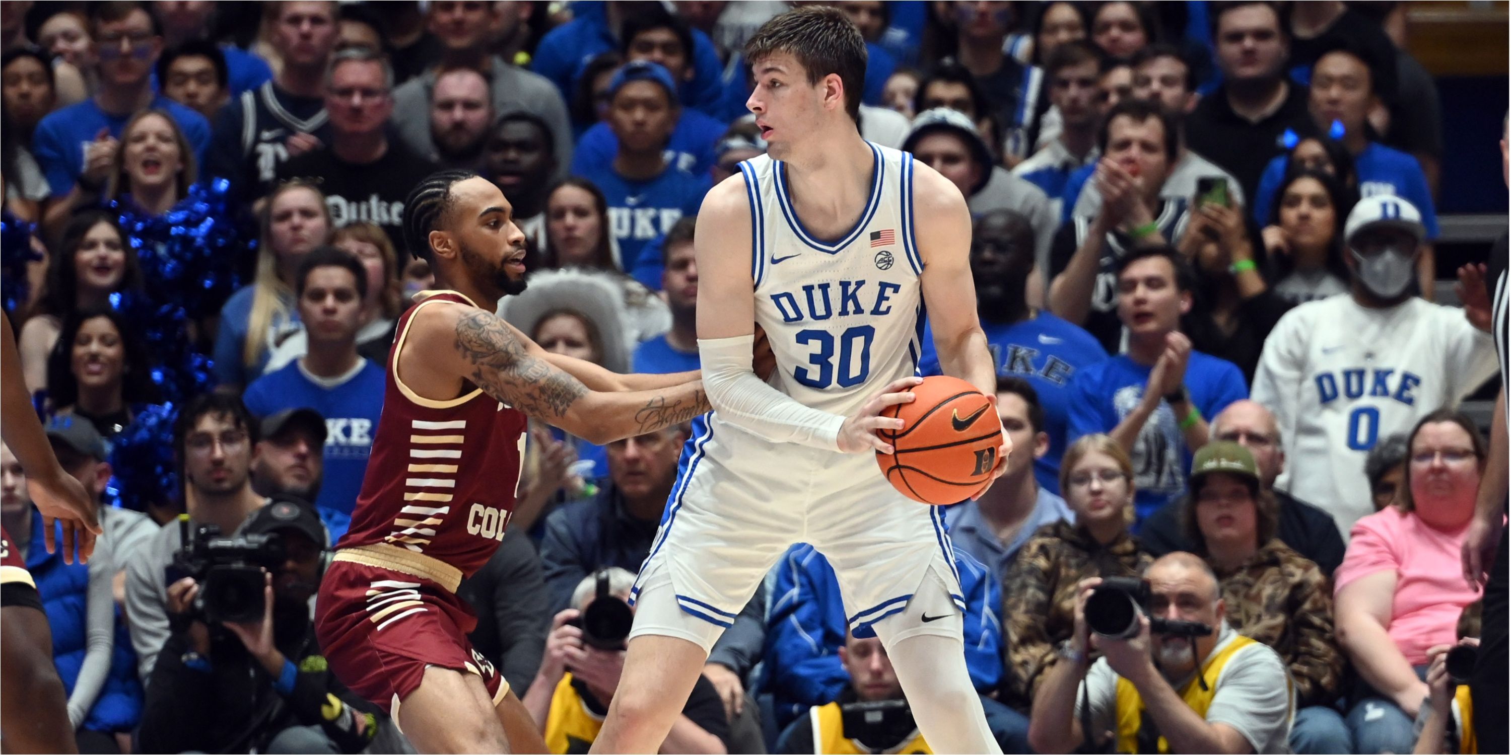 Duke center Kyle Filipowski posts up against Boston College