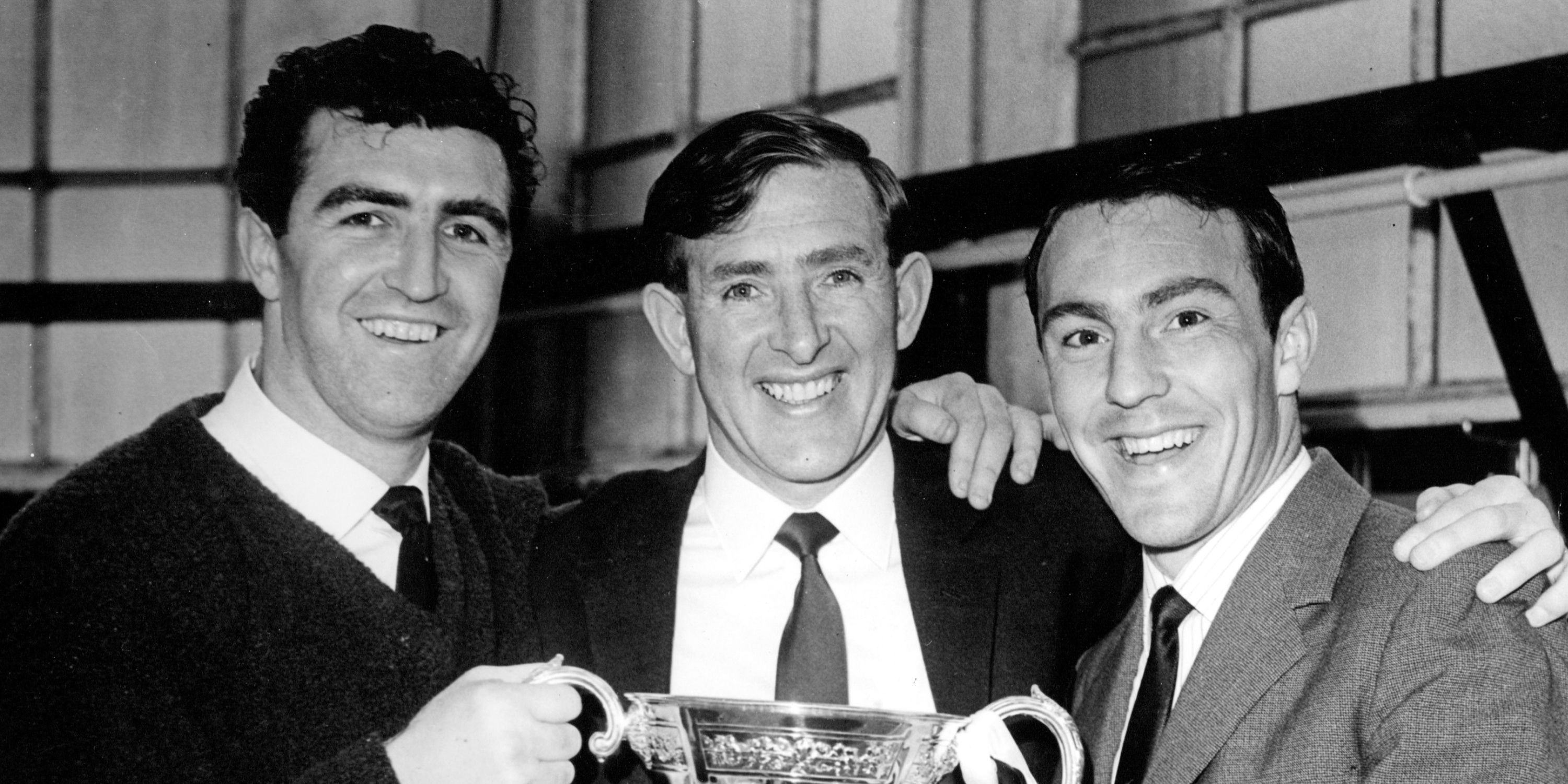 Bobby Smith lifting the cup with Danny Blanchflower and Jimmy Greaves