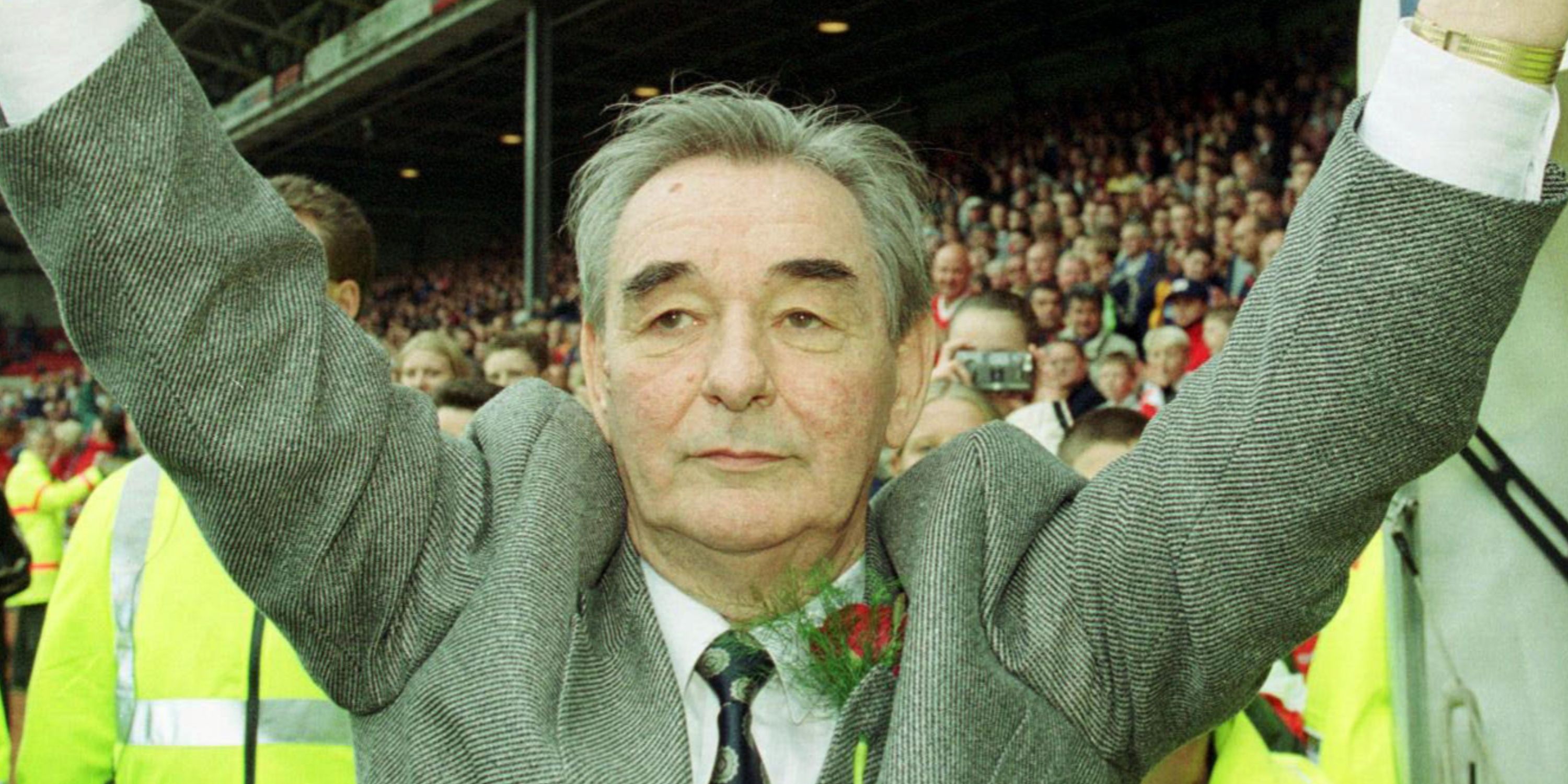 Brian Clough with his arms in the air