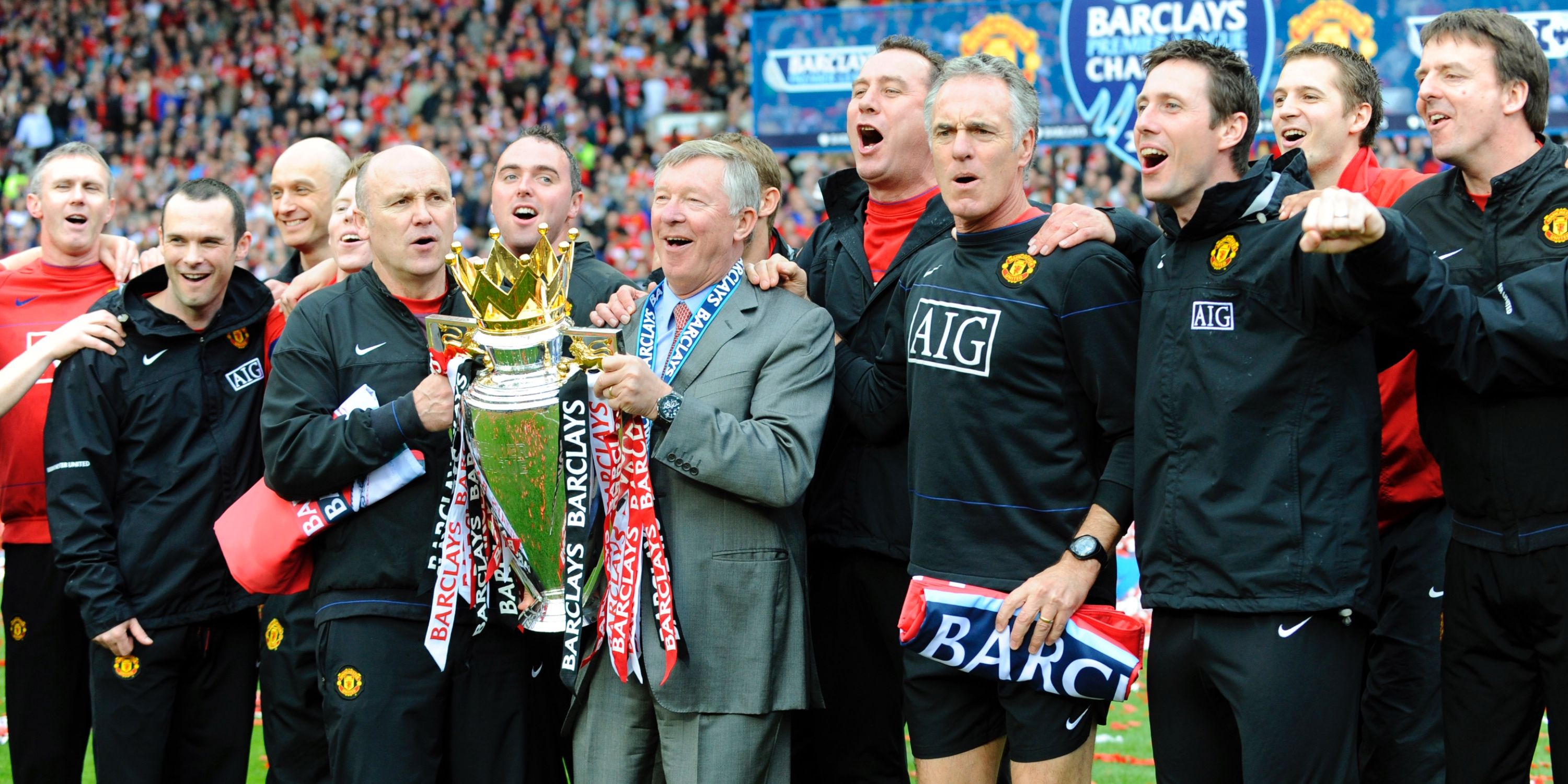 Sir Alex Ferguson and staff with the Premier League trophy