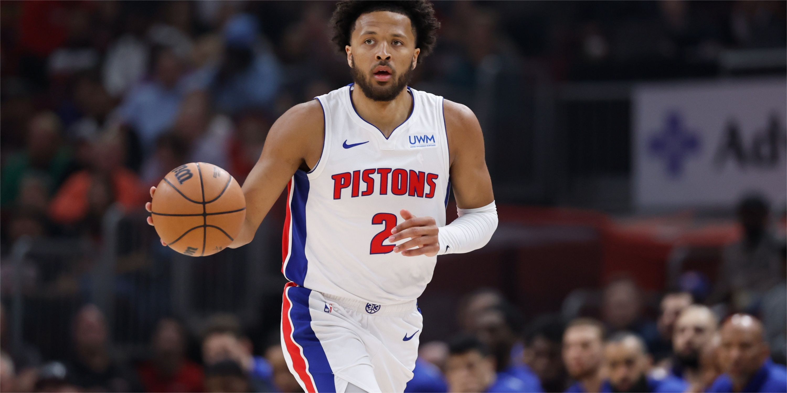 Pistons guard Cade Cunningham dribbles up the court 