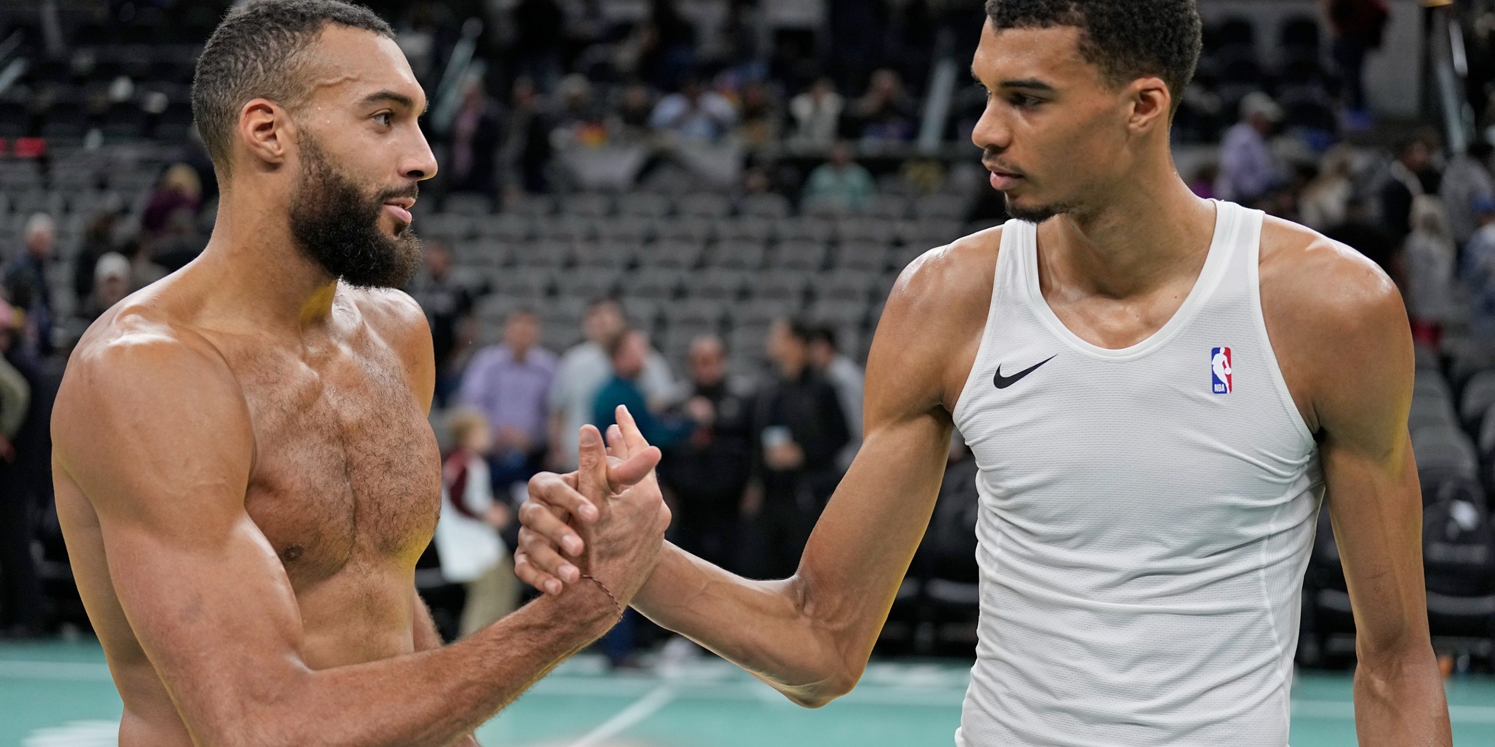 Victor Wembanyama and Rudy Gobert shake hands