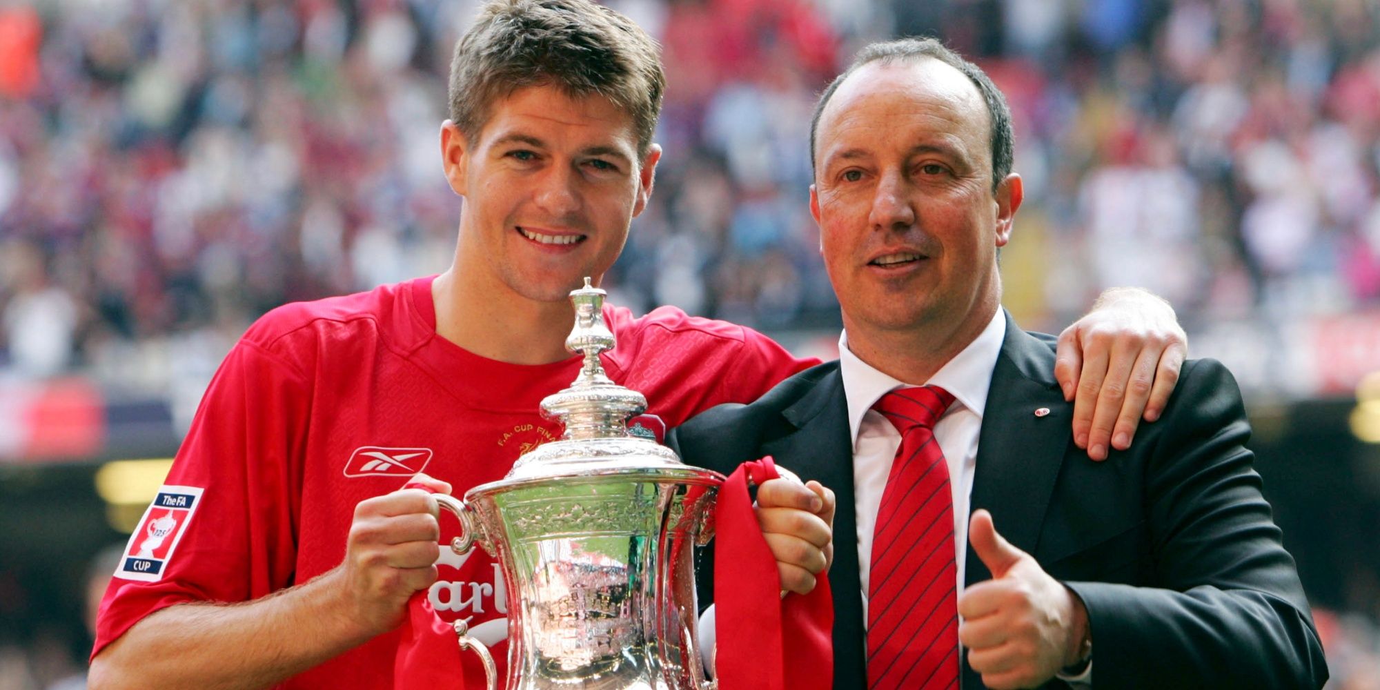 Liverpool's Steven Gerrard and manager Rafael Benitez pose with the FA Cup after victory over West Ham