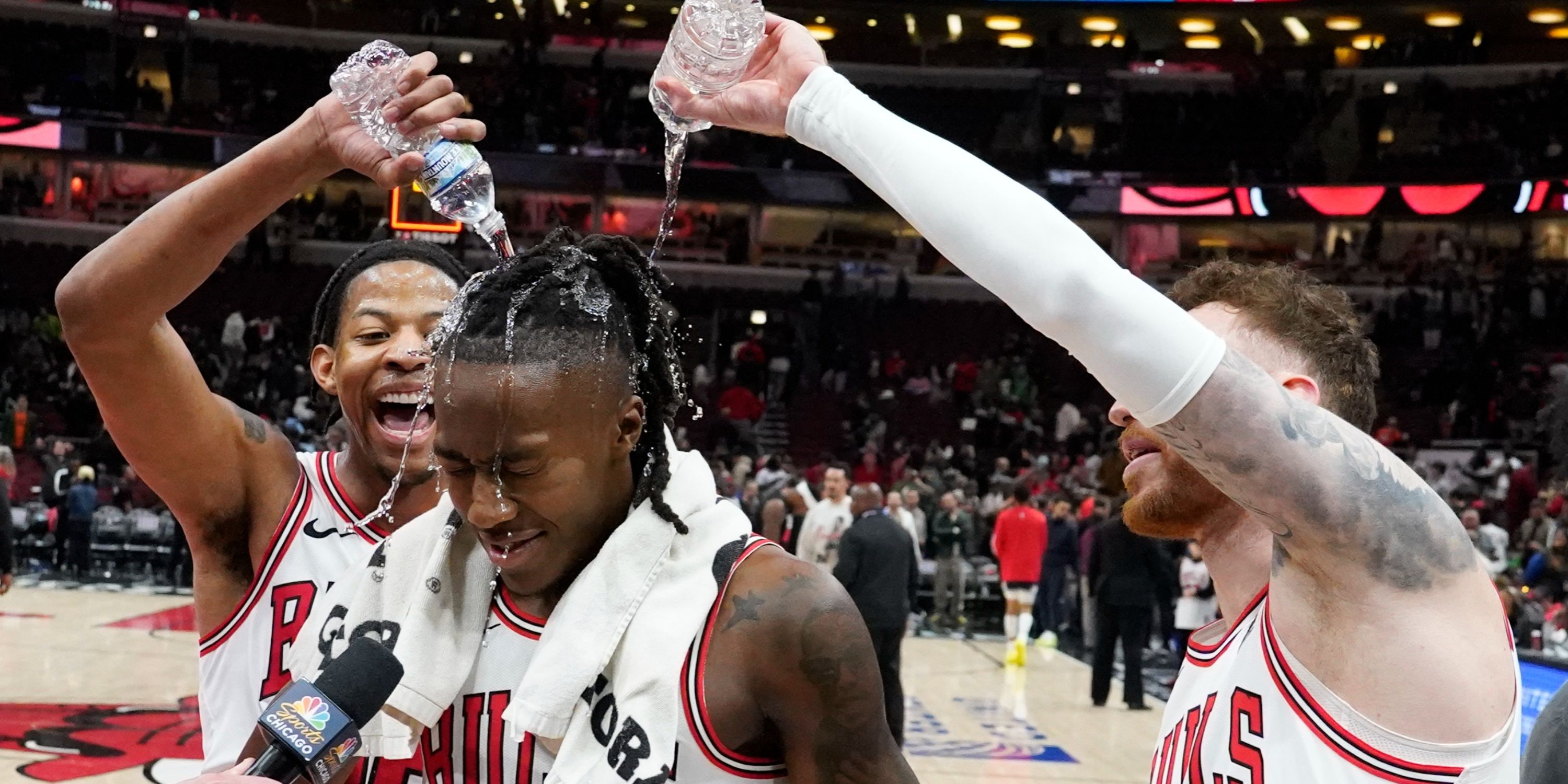 Chicago Bulls guard Ayo Dosunmu doused with water