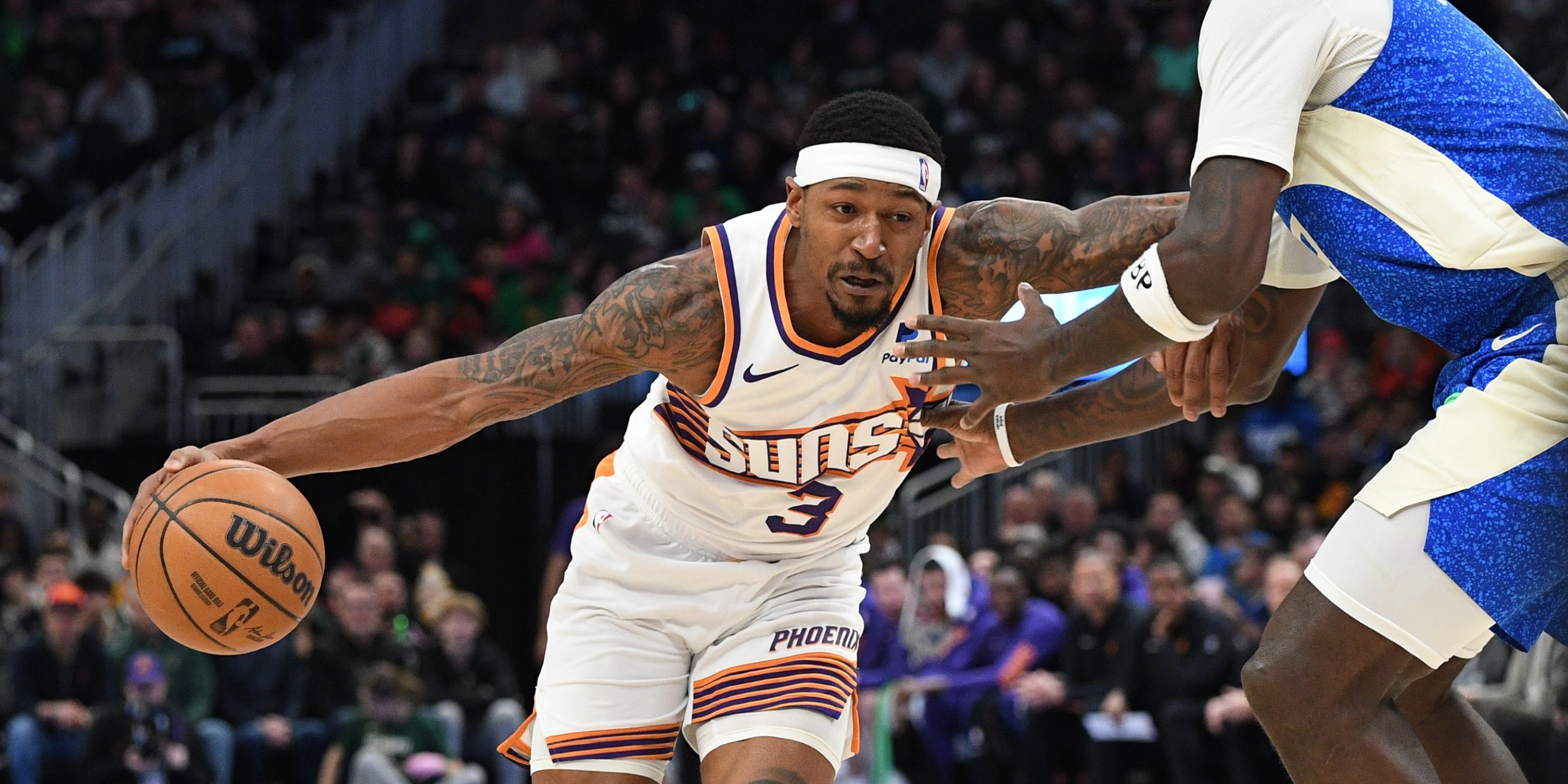 Phoenix Suns guard Bradley Beal drives against defense