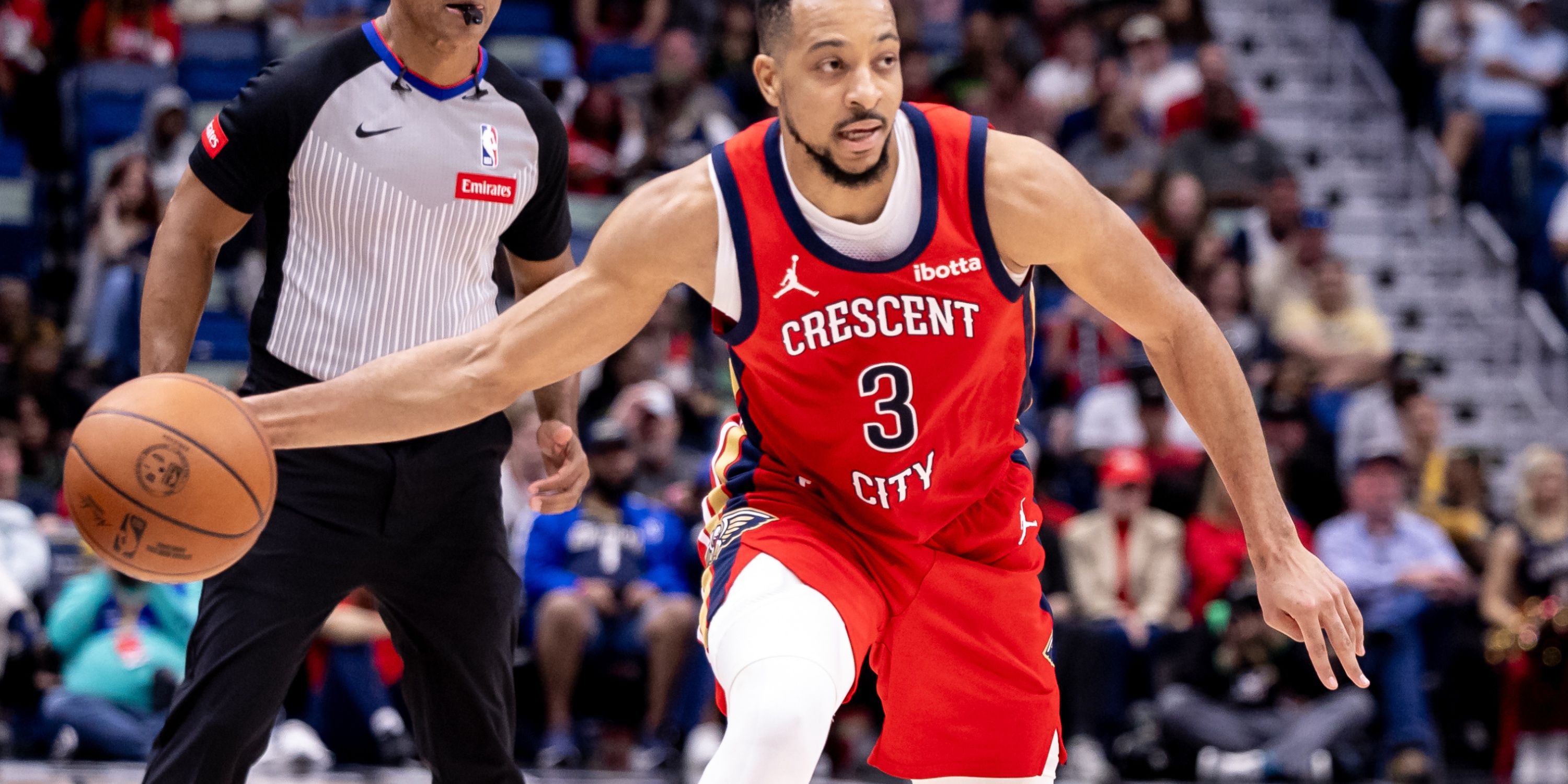 New Orleans Pelicans guard CJ McCollum dribbles