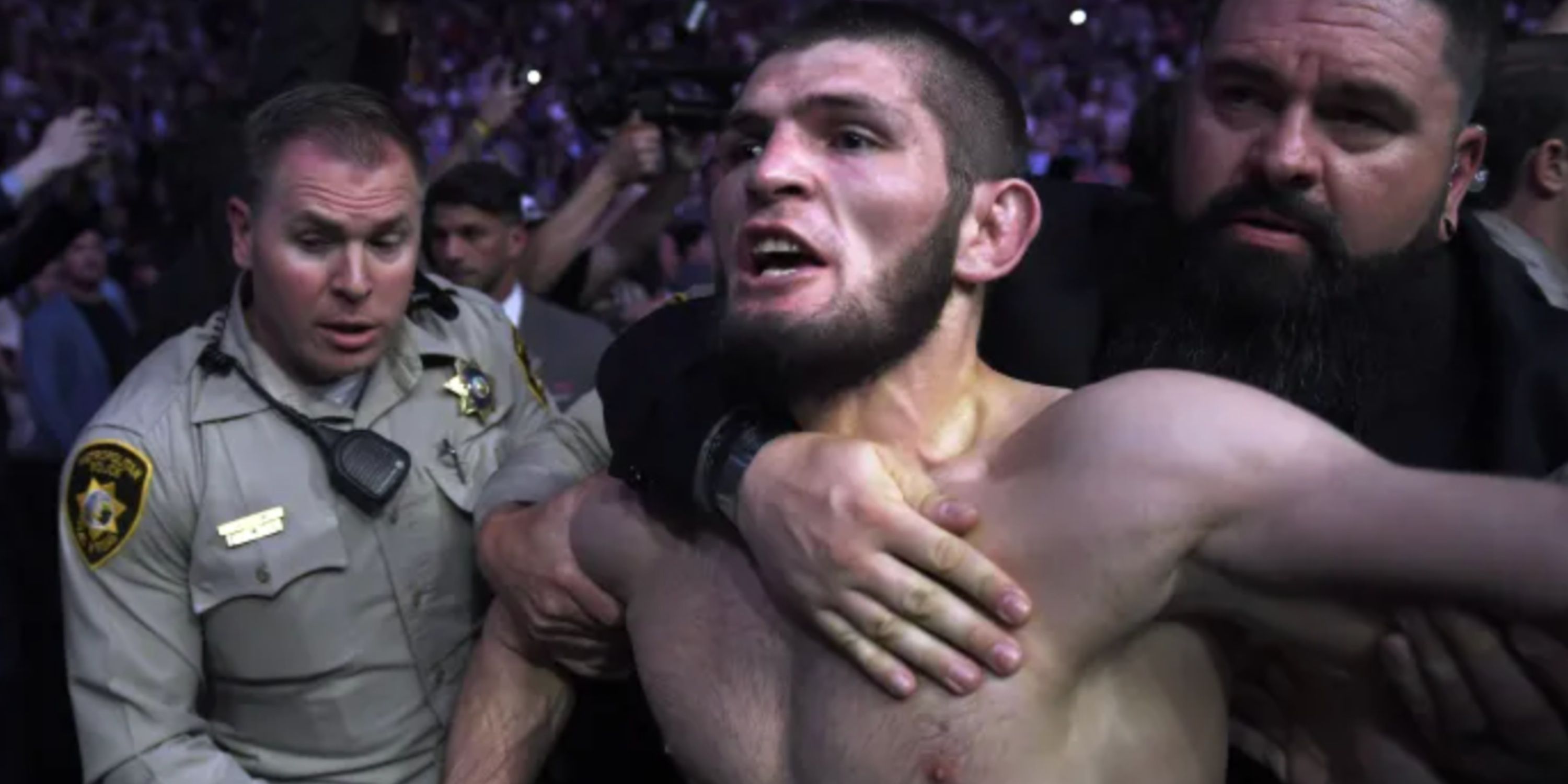 Khabib being restrained during UFC 229 brawl