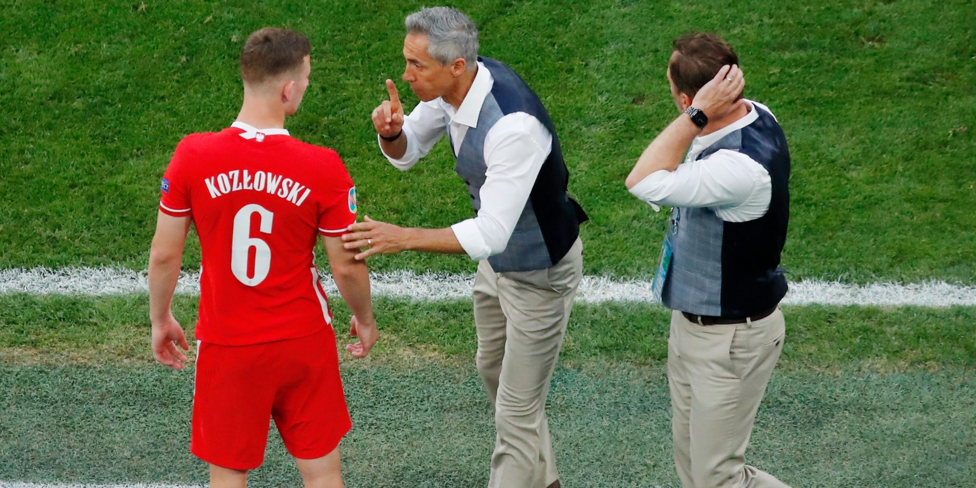 Kacper Kozlowski alongside Paulo Sousa, then Poland coach, at Euro 2021.