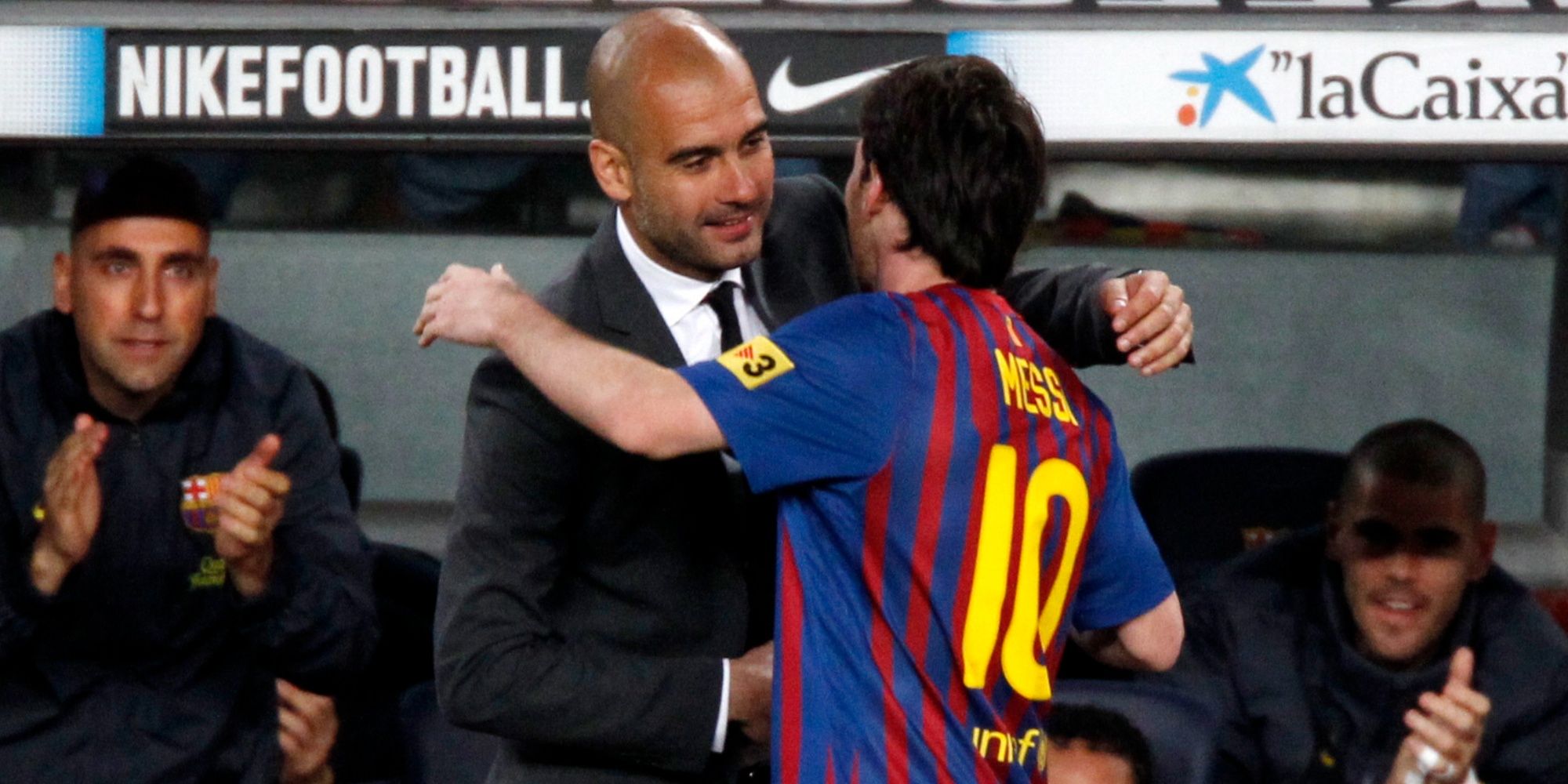 Barcelona's Lionel Messi celebrates with coach Pep Guardiola