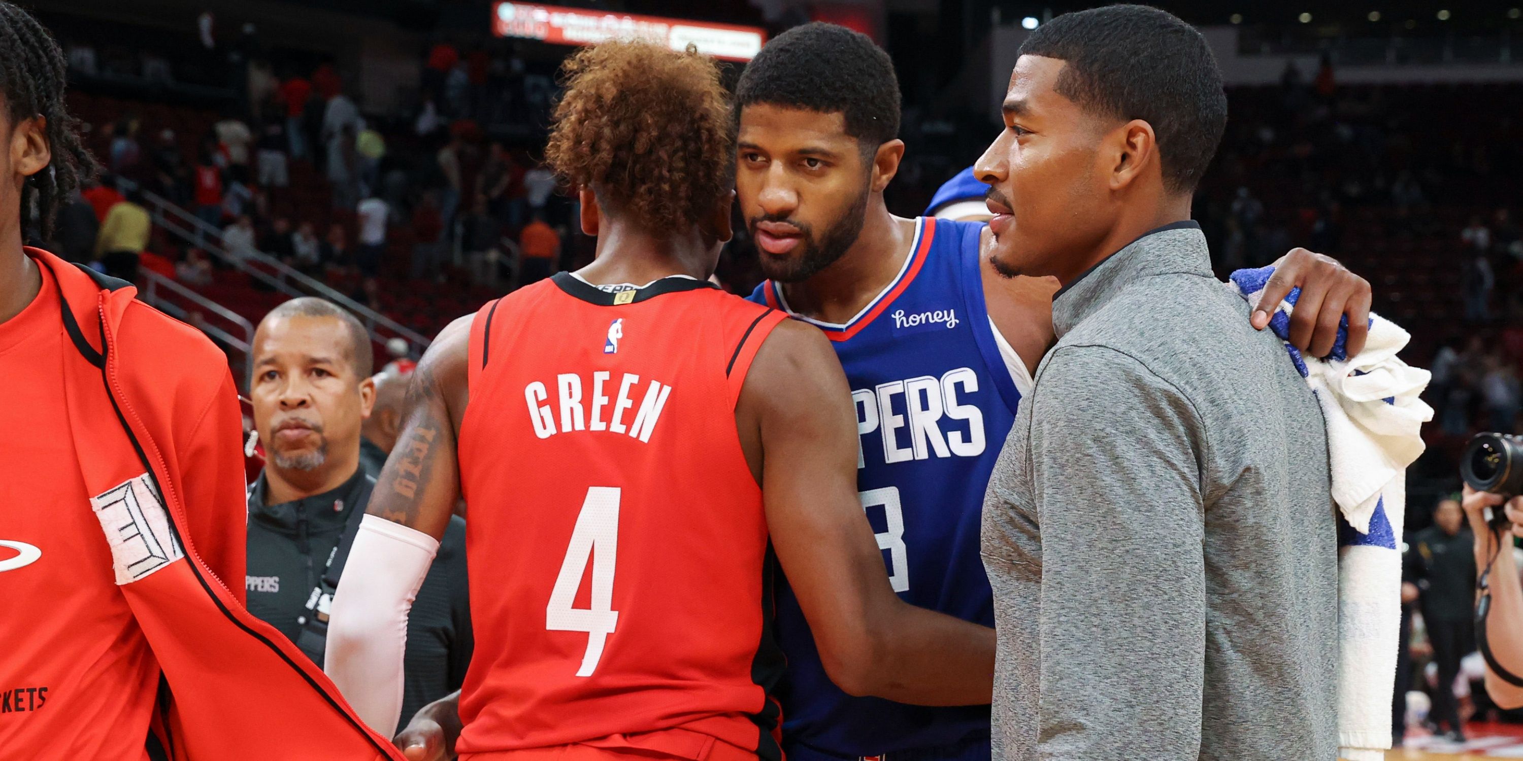 Houston Rockets guard Jalen Green chats with Los Angeles Clippers forward Paul George after the game