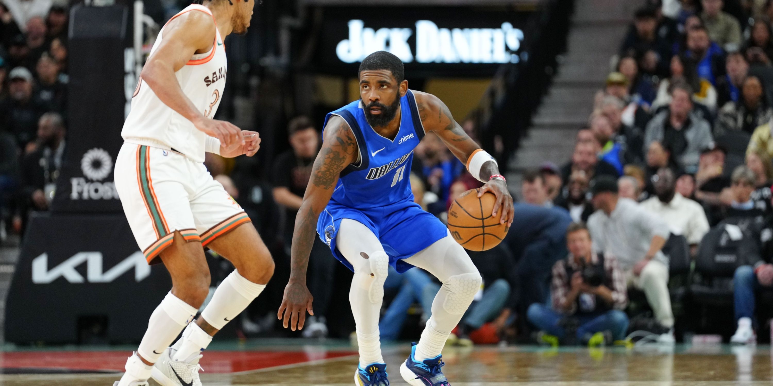 Dallas Mavericks guard Kyrie Irving sizes up defender