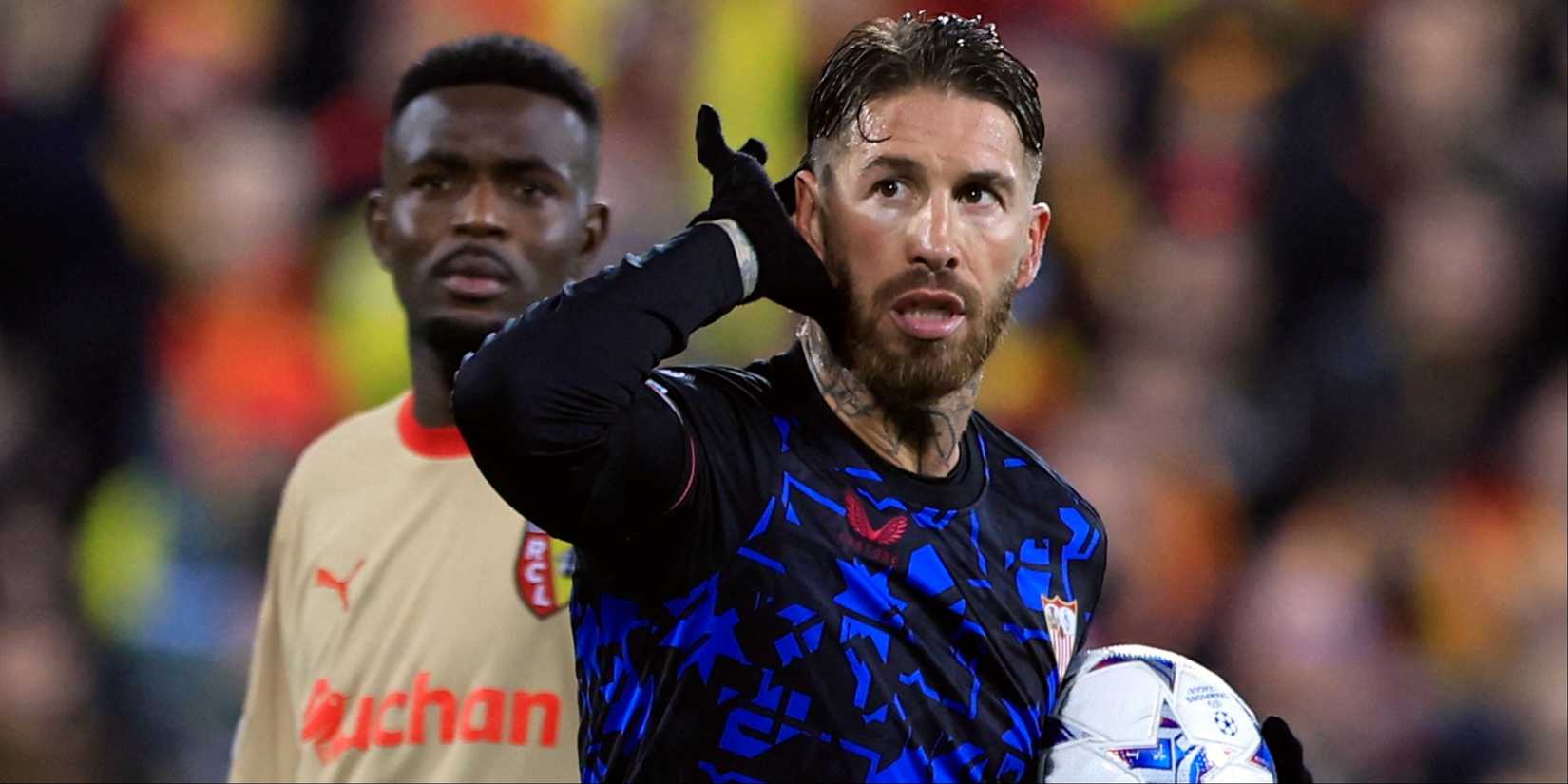 Sevilla's Sergio Ramos cups his ear after scoring against Lens. 