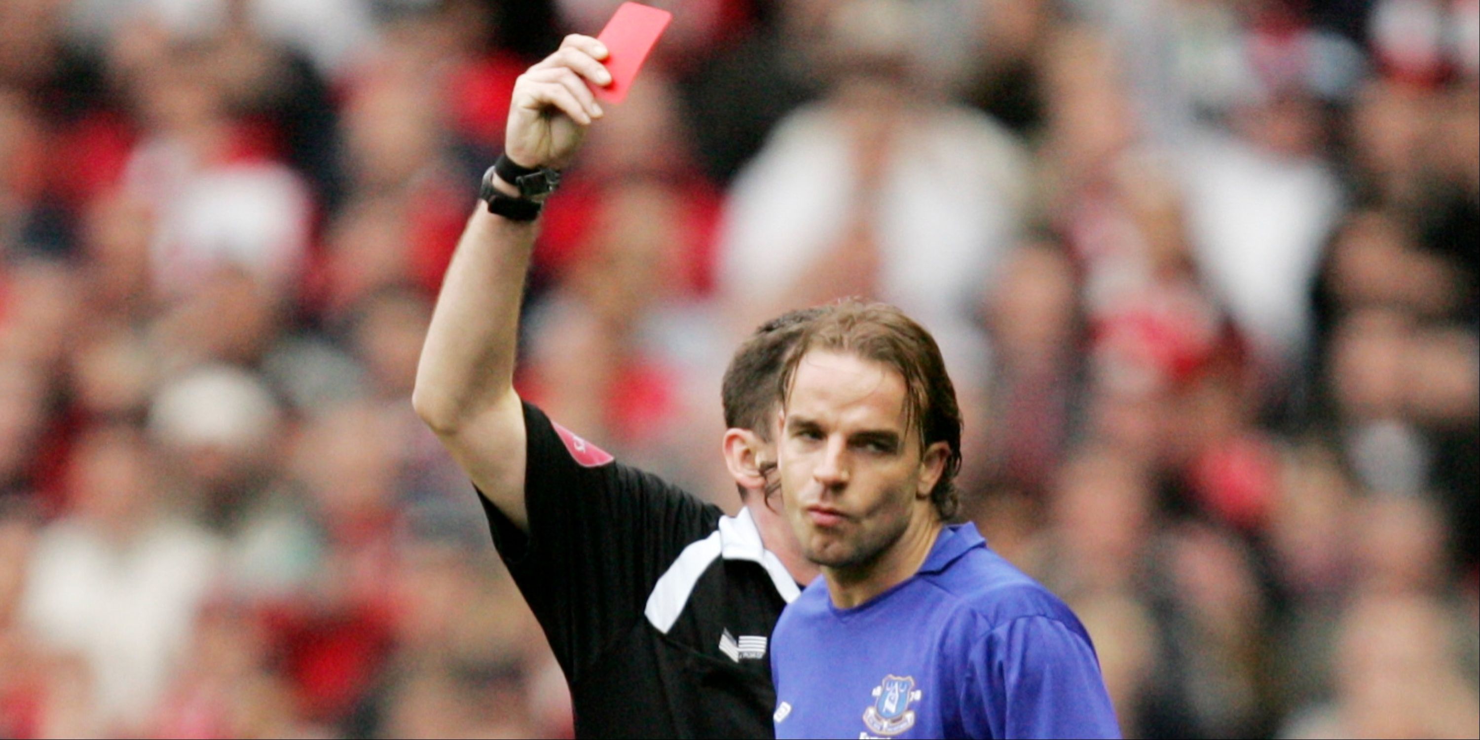 Everton's Andy van der Meyde is shown a red card.