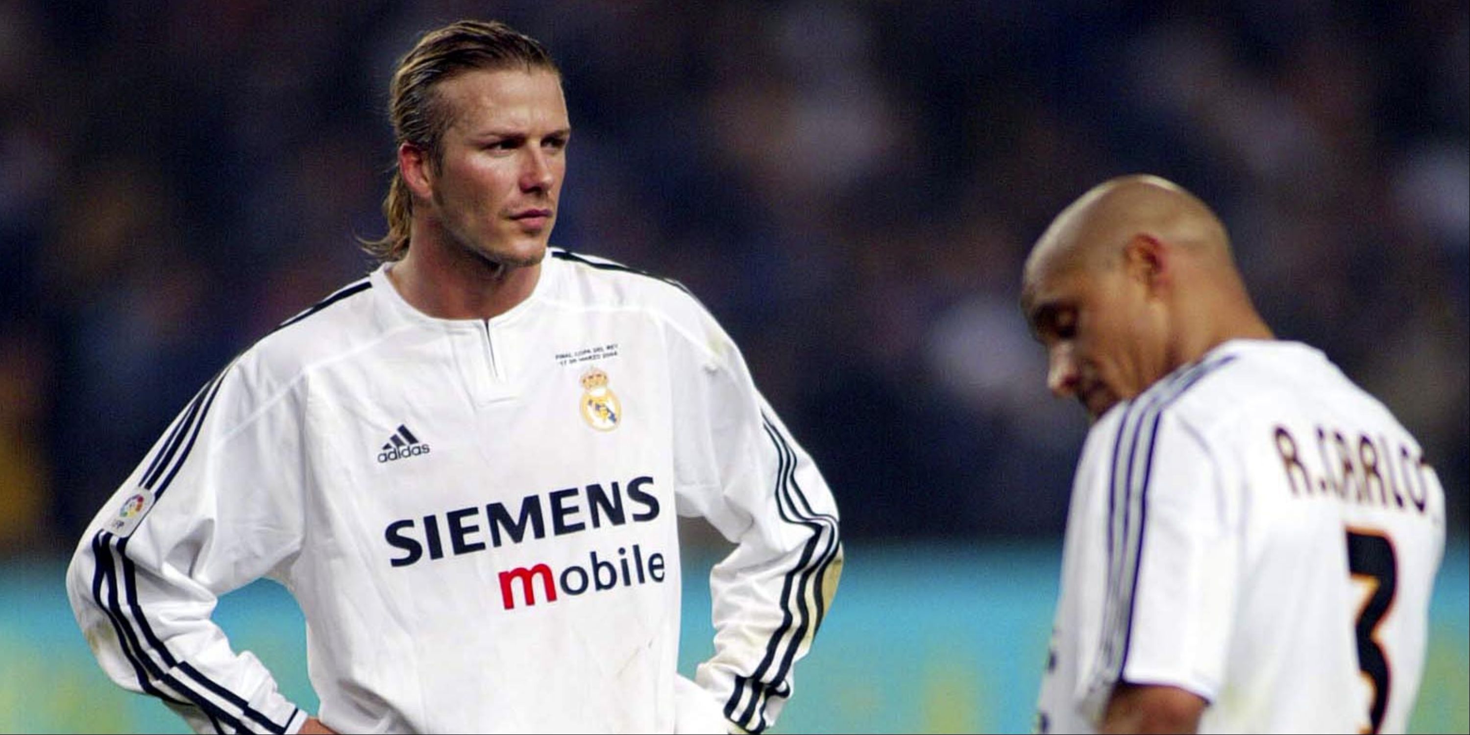 Real Madrid's David Beckham and Roberto Carlos look dejected. 