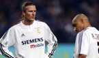 Real Madrid's David Beckham and Roberto Carlos look dejected. 