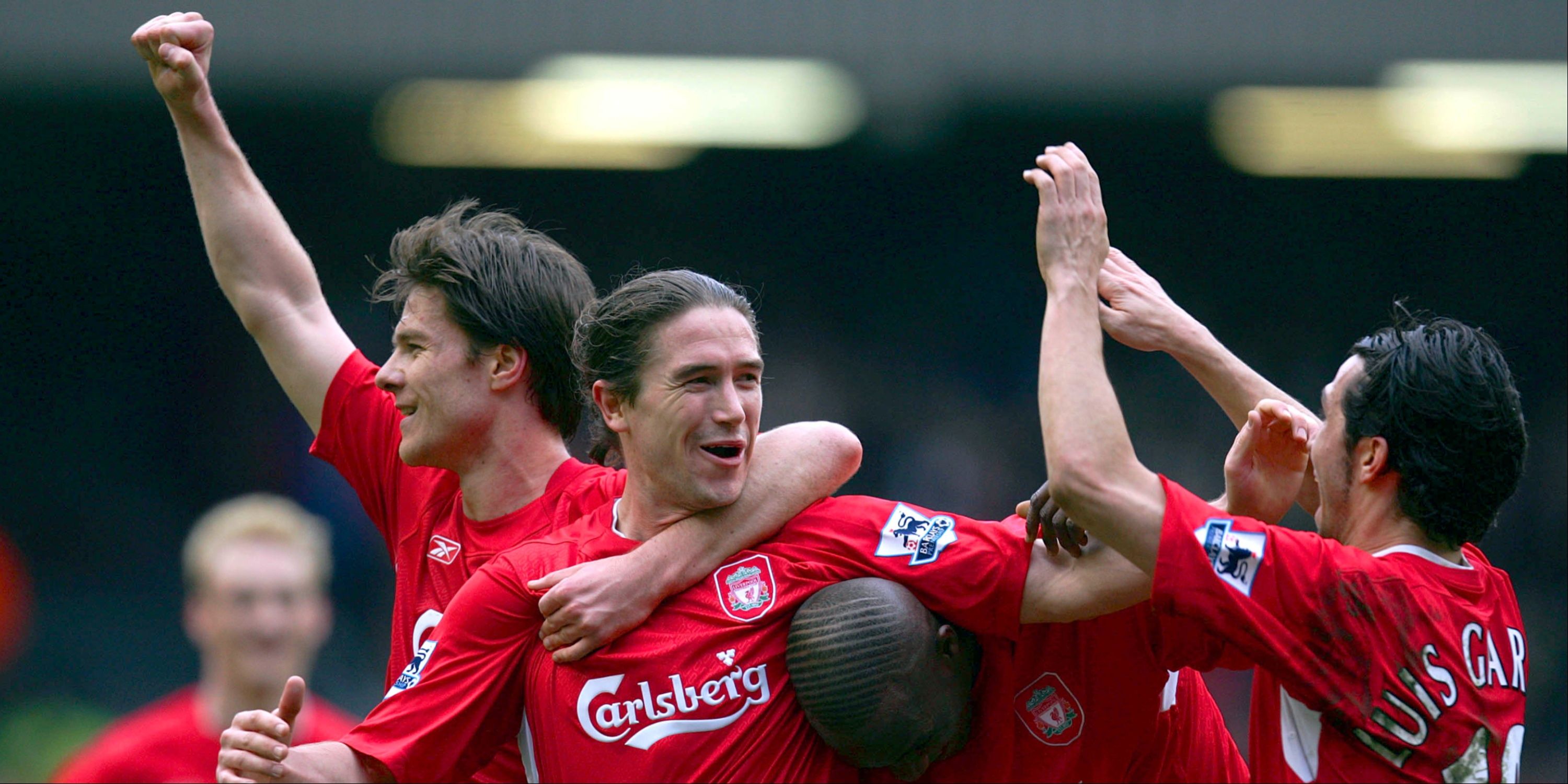 Liverpool's Harry Kewell is congratulated by his teammates after scoring. 