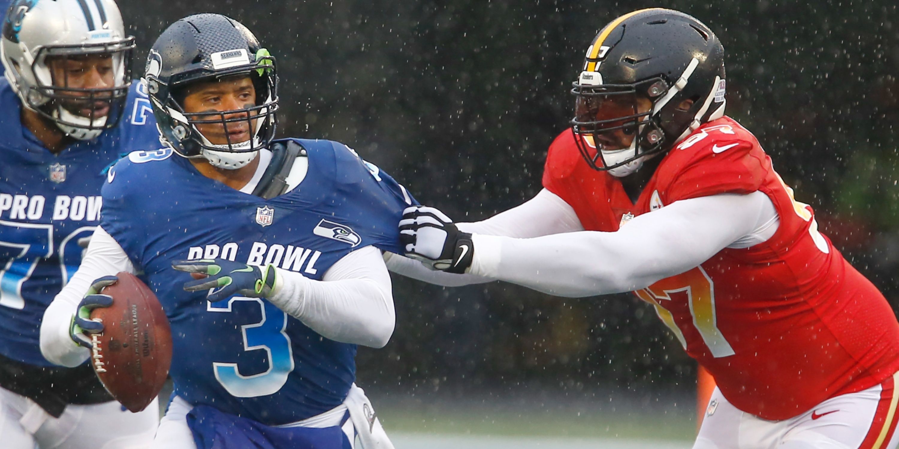 Cam Heyward attempts to sack Russell Wilson during the Pro Bowl