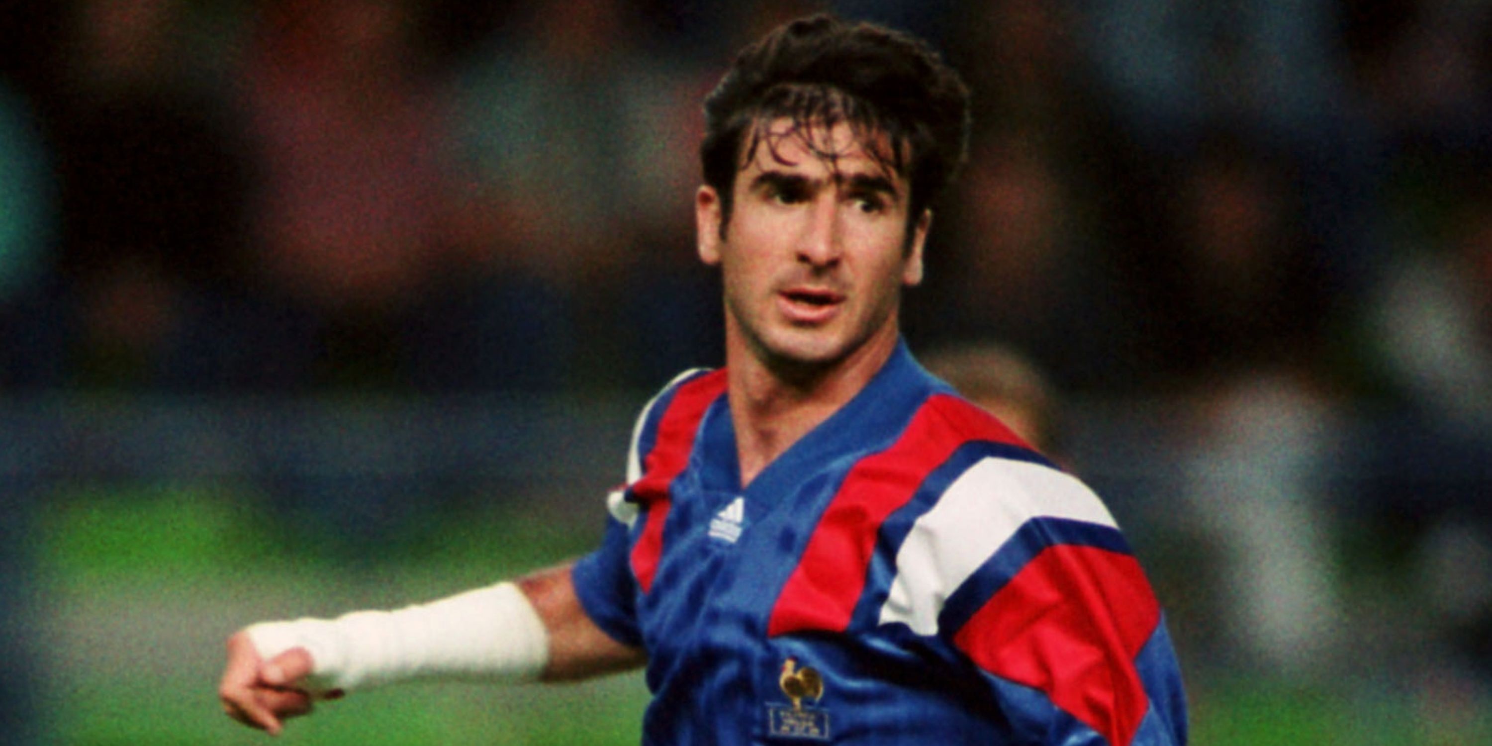 Eric Cantona of France looking on