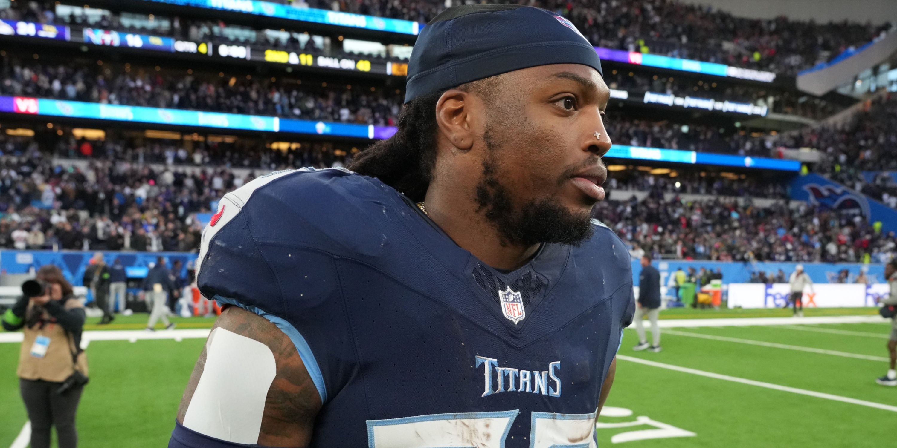 Derrick Henry walks off the field after a game
