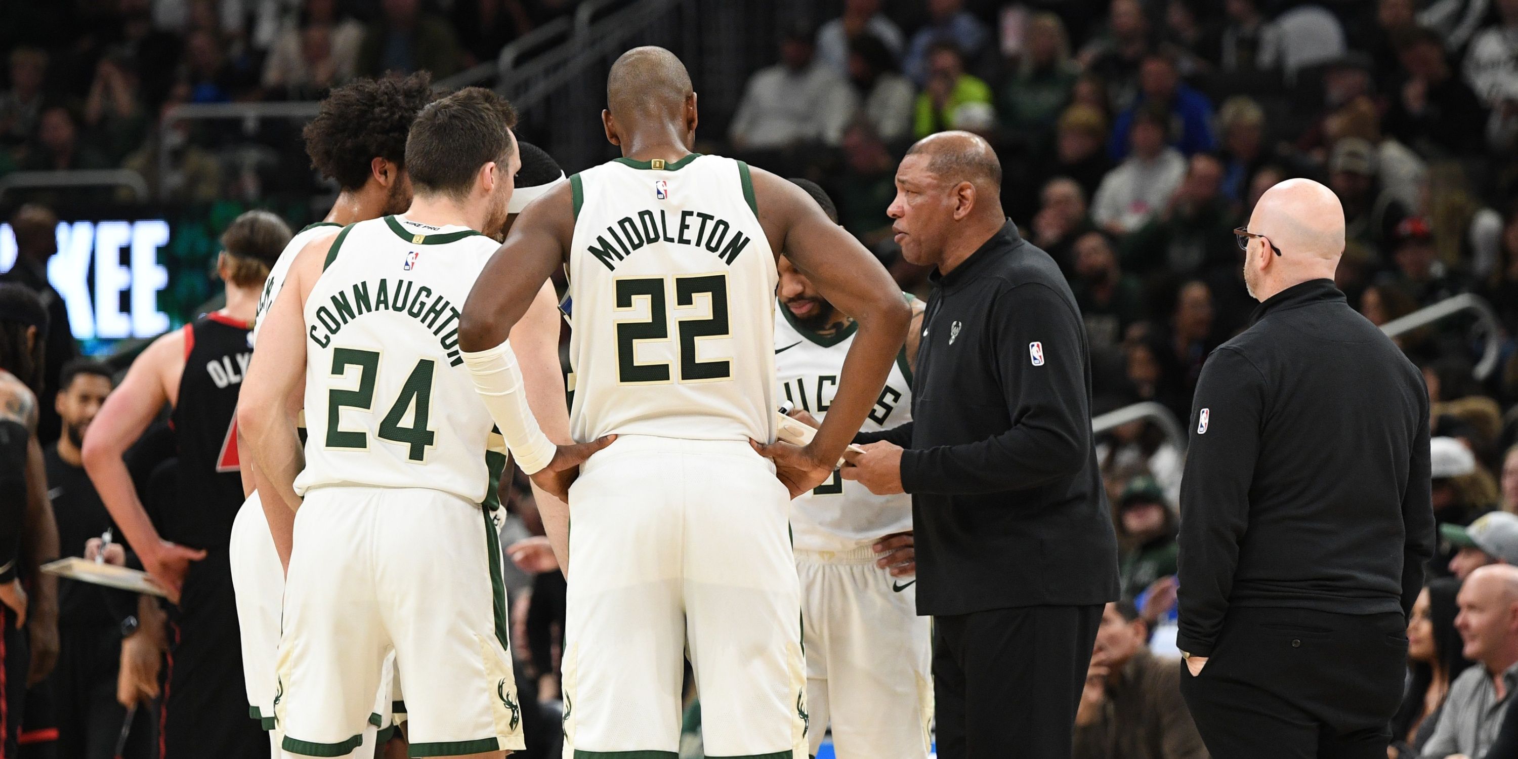 Bucks coach Doc Rivers with Khris Middleton and Pat Connaughton