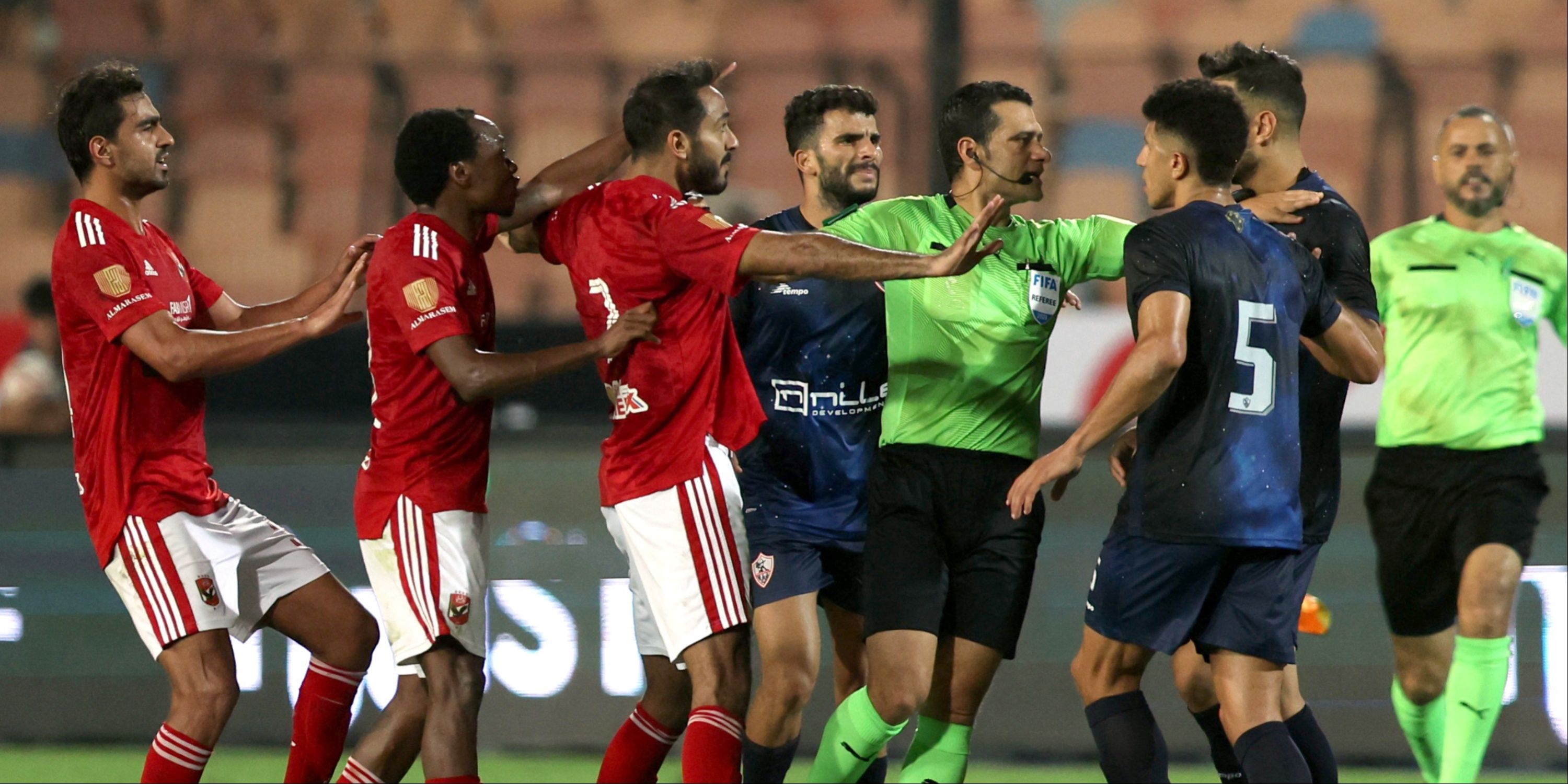 Al Ahly and Zamalek players clash