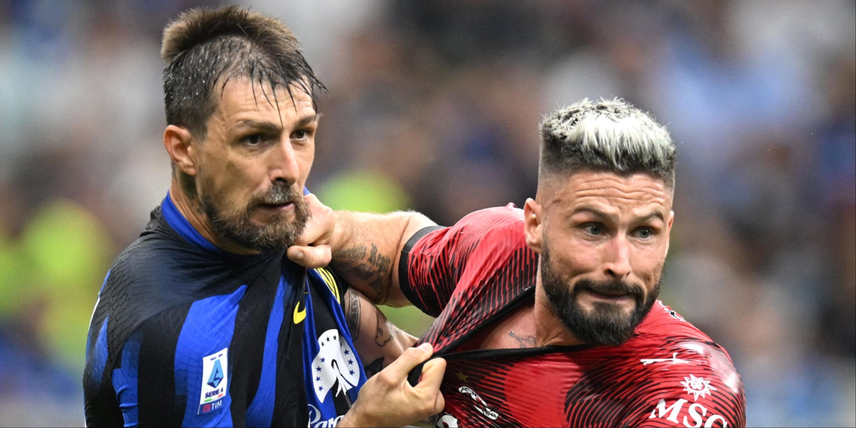 Francesco Acerbi and Olivier Giroud in action during the Milan derby