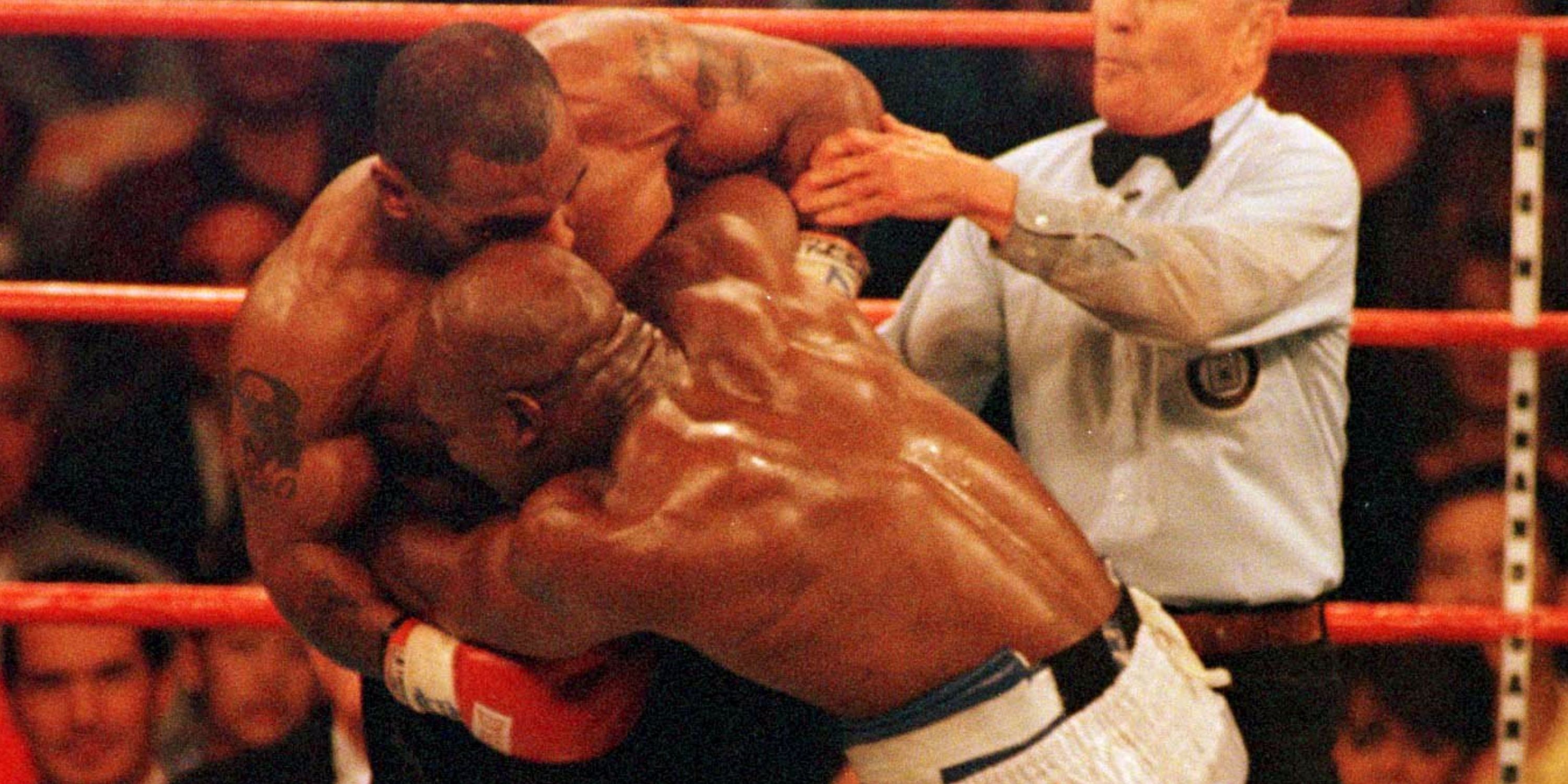 Mike Tyson biting Evander Holyfield's ear