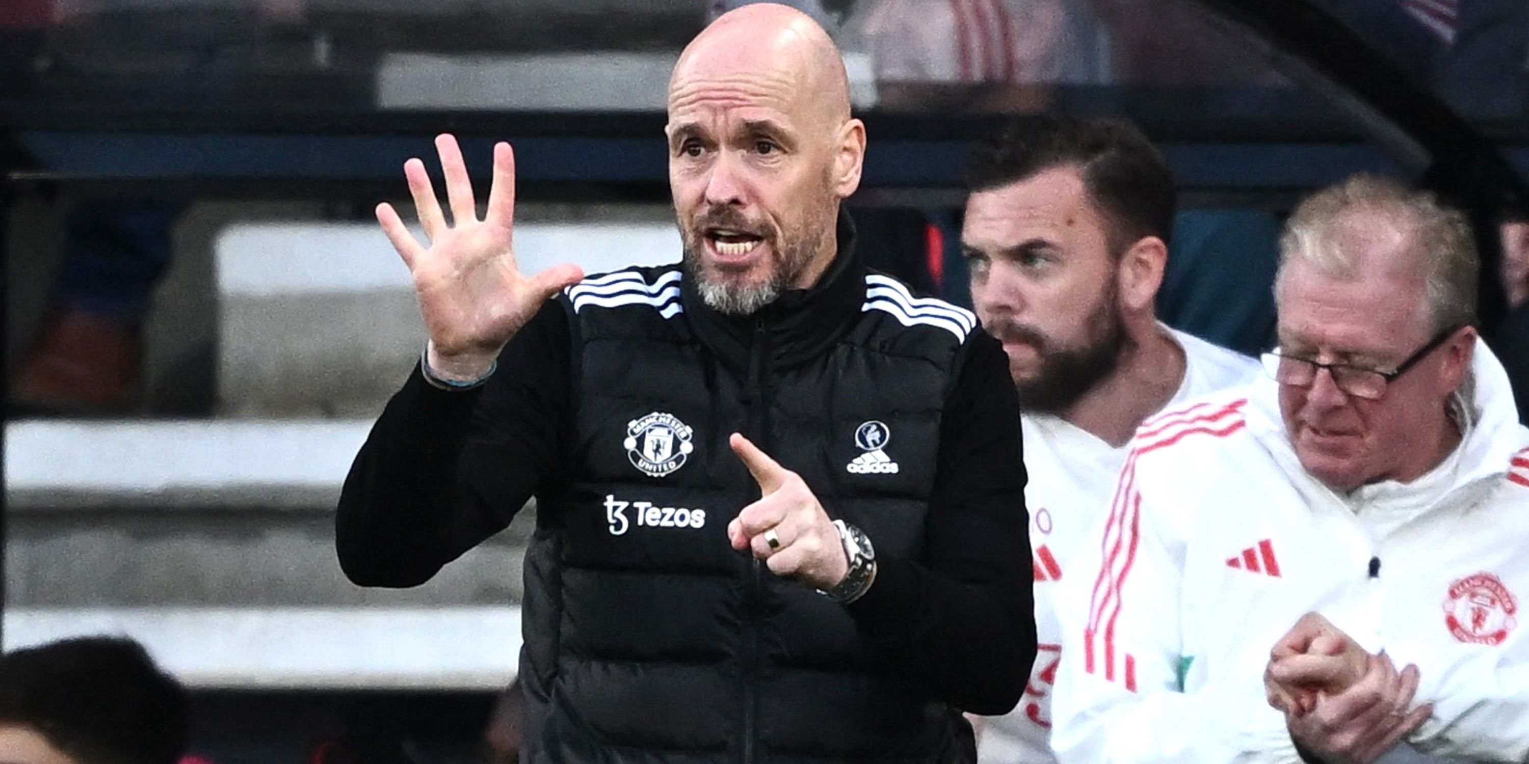 Manchester United boss Erik ten Hag passing instructions onto his players