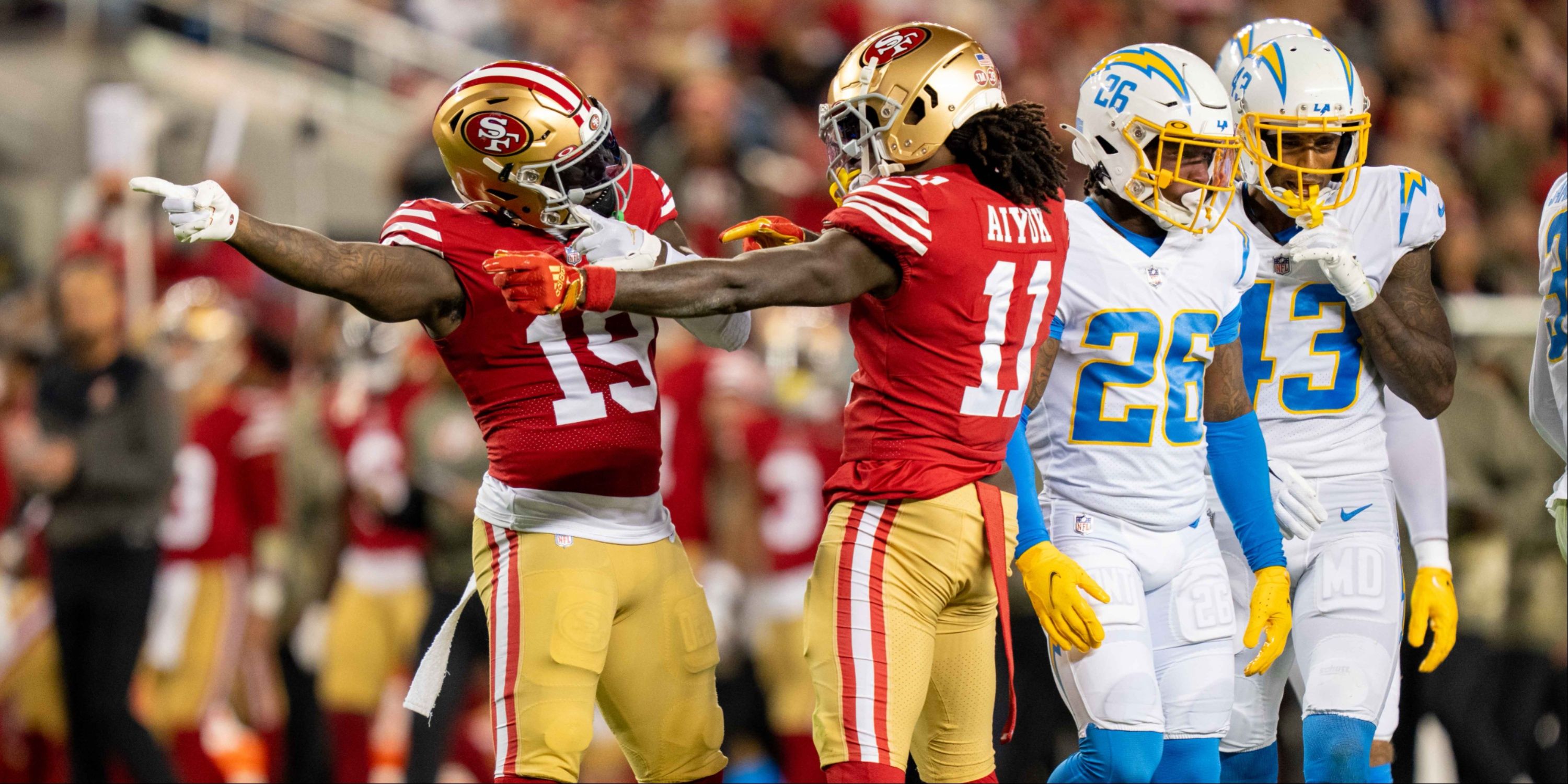 Brandon Aiyuk and Deebo Samuel celebrate a first down