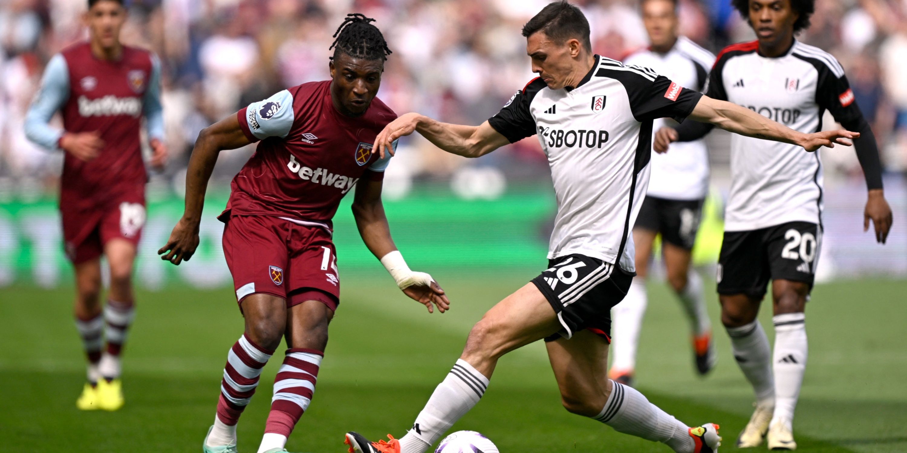 West Ham United winger Mohammed Kudus and Fulham defensive midfielder Joao Palhinha battling for possession